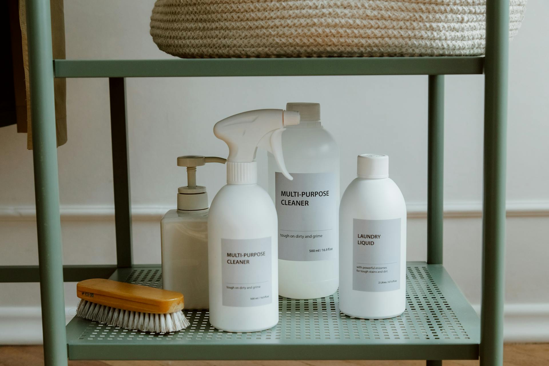 Cleaning supplies on a shelf | Source: Pexels