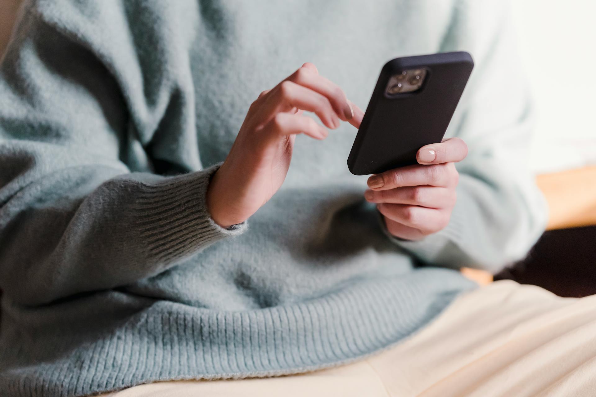 A close-up shot of woman checking her smartphone | Source: Pexels