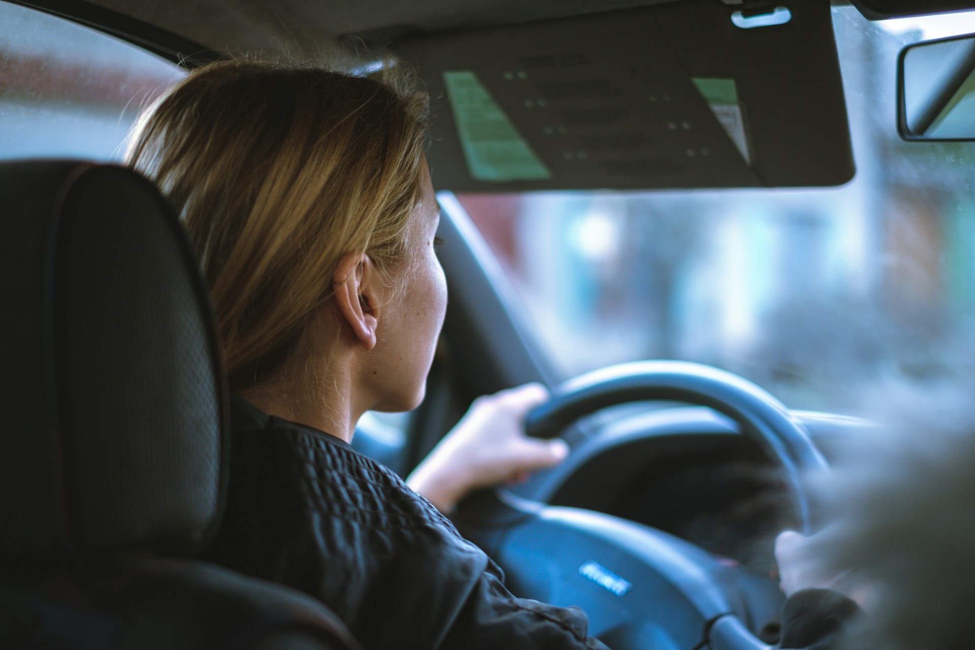 My Sister Made Me Eat in the Garage at Her Wedding Because 'There Wasn't Enough Space for Everyone Inside' 21 A woman driving a car | Source: Unsplash