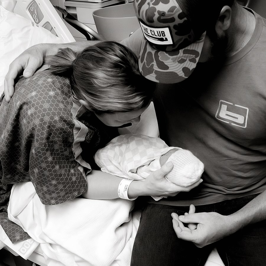 Alex and Drake White hold their late baby girl in a photo shared on September 7, 2025. | Source: Instagram/alexm_white/drakewhitestomp