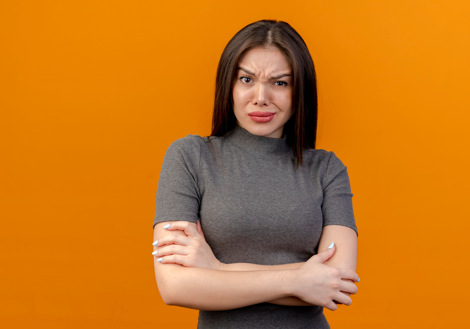 My Daughter Told Me Not to Visit Her Family Again — Days Later, She Was at My Door Begging 2 A frustrated woman with her arms crossed | Source: Freepik