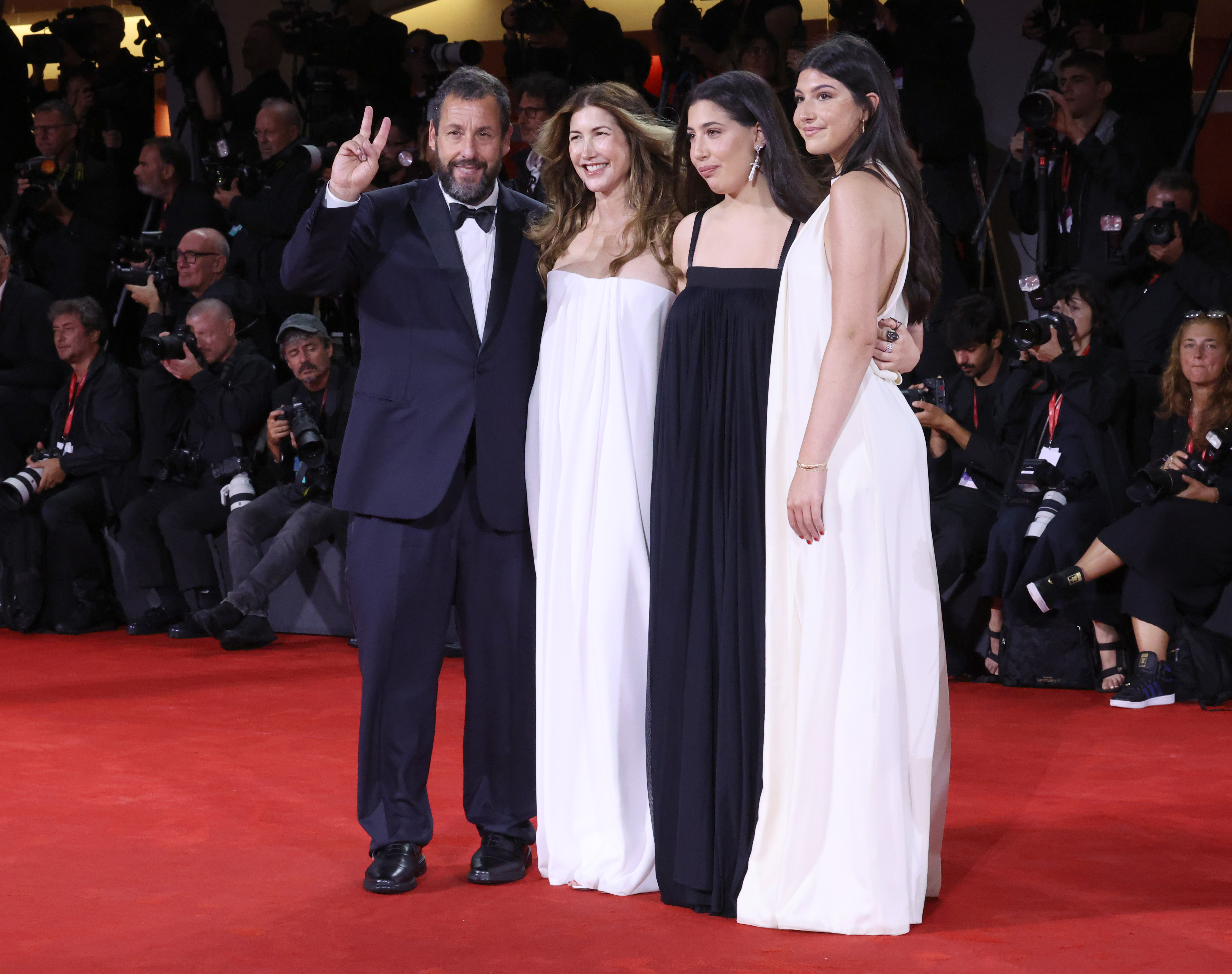 Adam Sandler, Jackie Sandler, Sadie Madison Sandler and Sunny Madeline Sandler attend the "Jay Kelly" red carpet during the 82nd Venice International Film Festival on August 28, 2025, in Venice, Italy. | Source: Getty Images