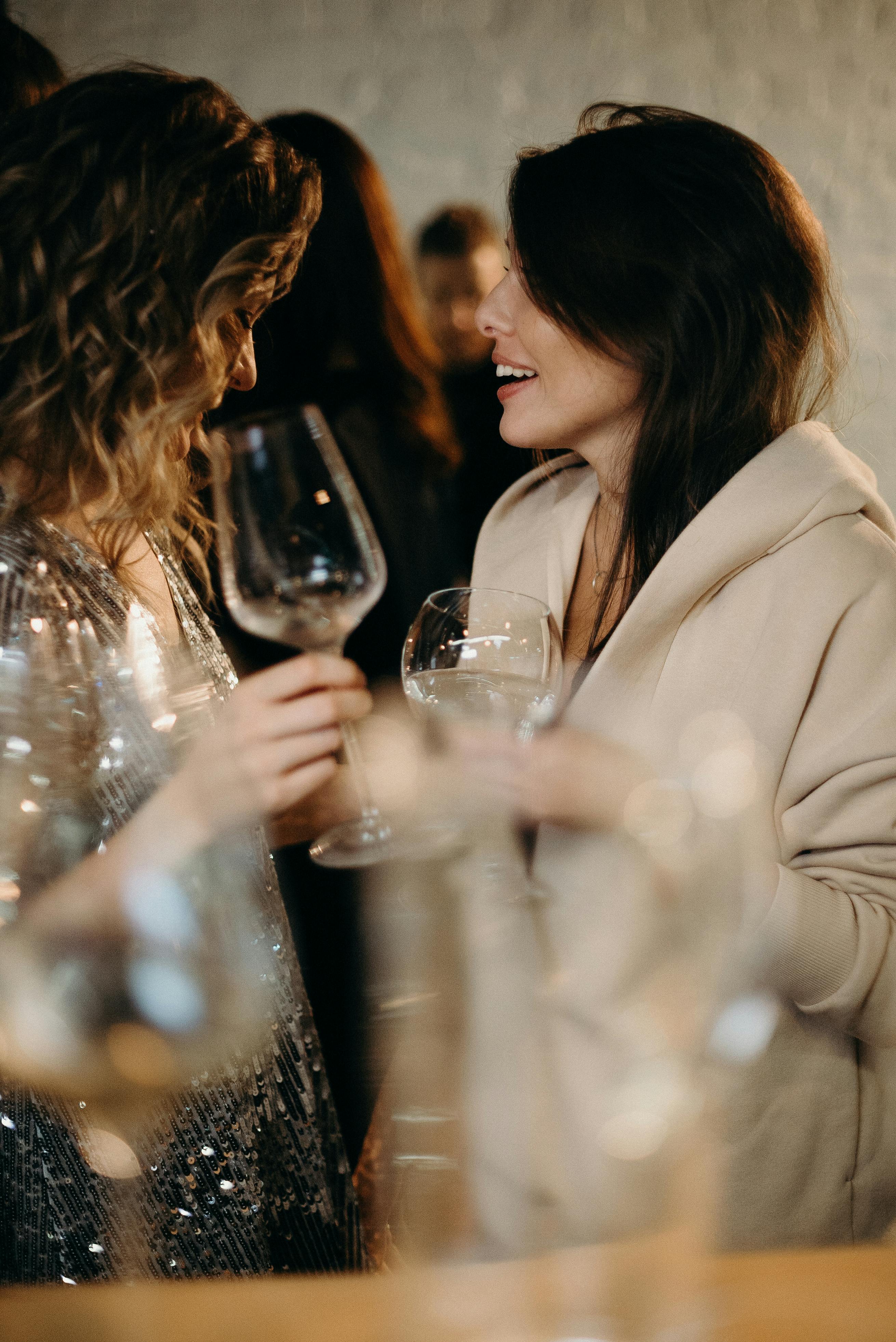 Women holding wine glasses | Source: Pexels