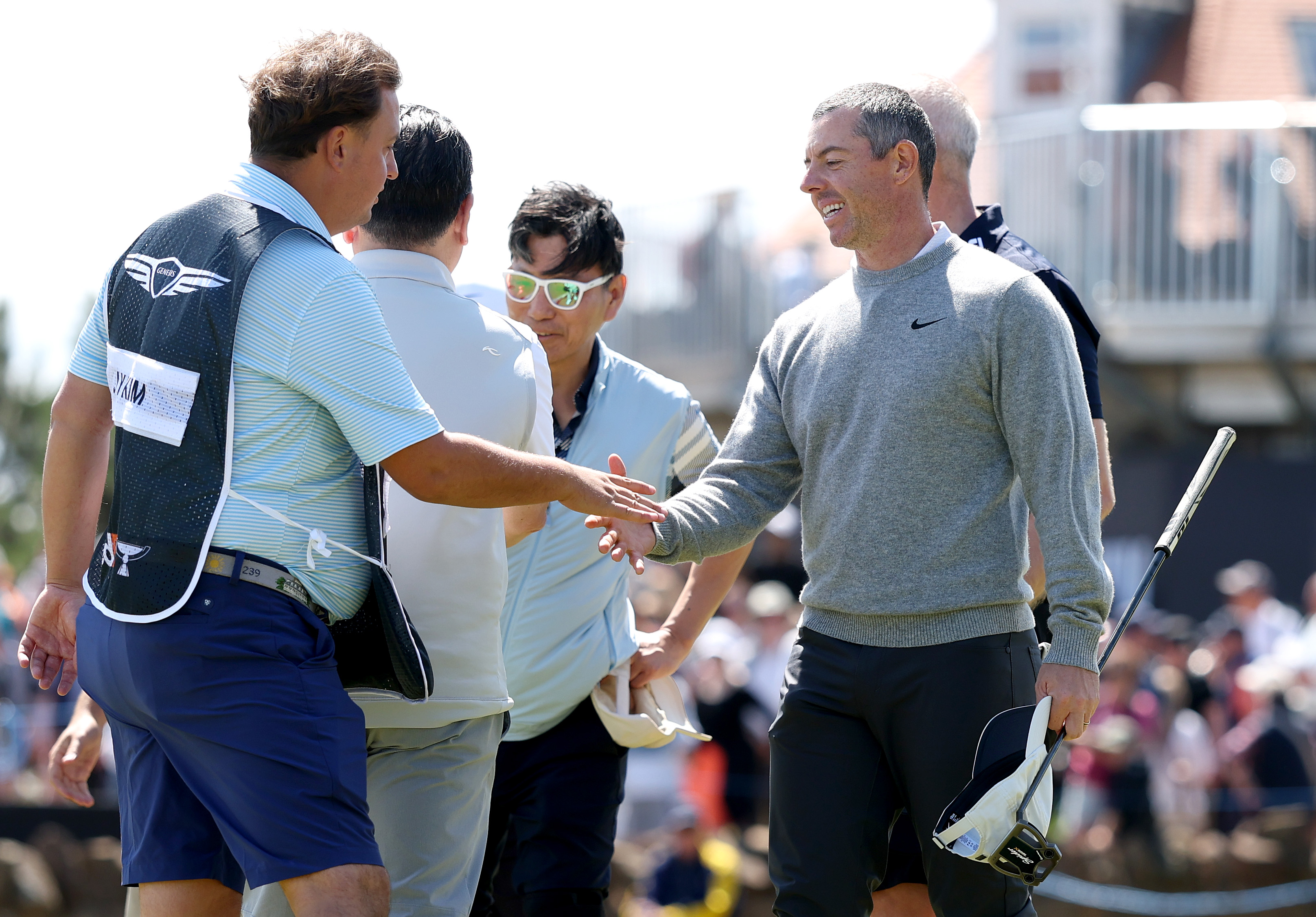 Rory McIlroy shakes hands with his group following their round during the pro-am prior to the Genesis Scottish Open 2025 at The Renaissance Club on July 09, 2025 in North Berwick, Scotland. | Source: Getty Images