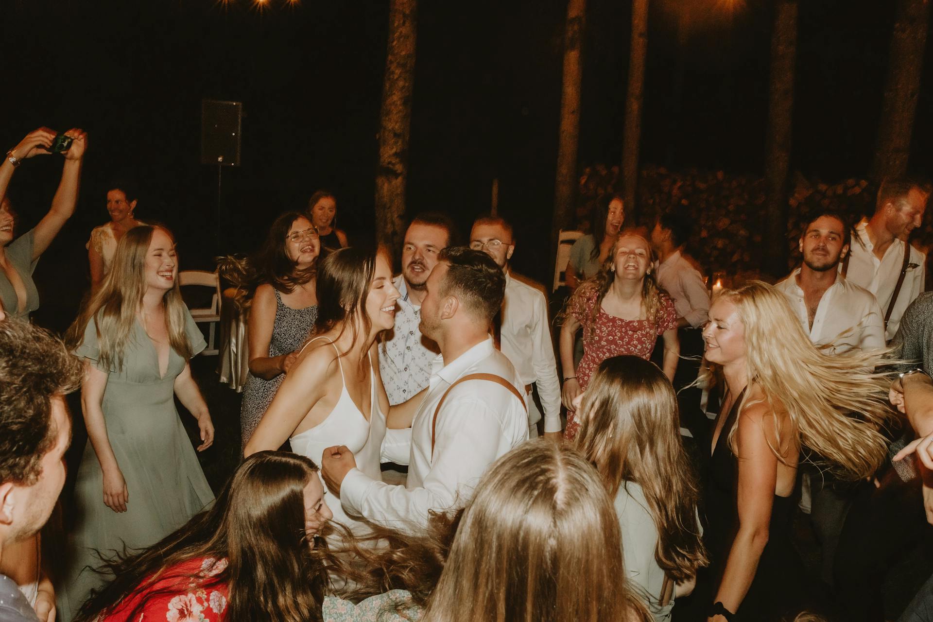 People having fun dancing at a wedding reception | Source: Pexels