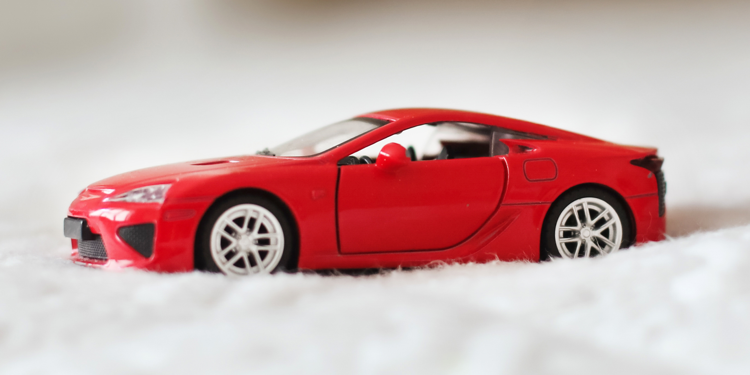 A red toy car | Source: Shutterstock