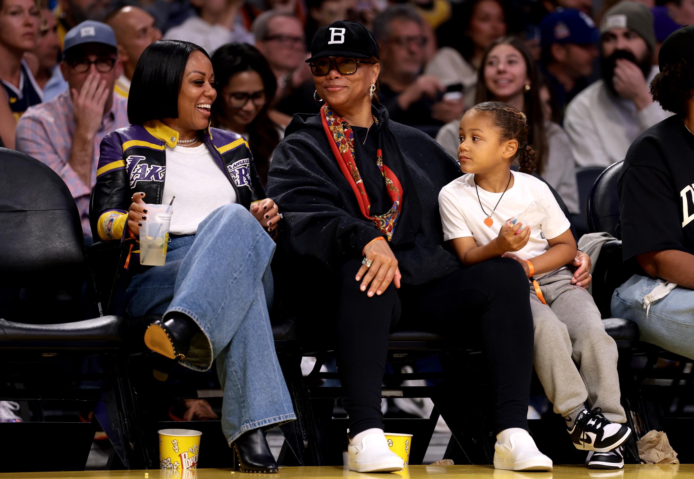 Eboni Nichols and Queen Latifah attend the game between the Los Angeles Lakers and the Denver Nuggets at Crypto.com Arena on March 19, 2025, in Los Angeles, California. | Source: Getty Images