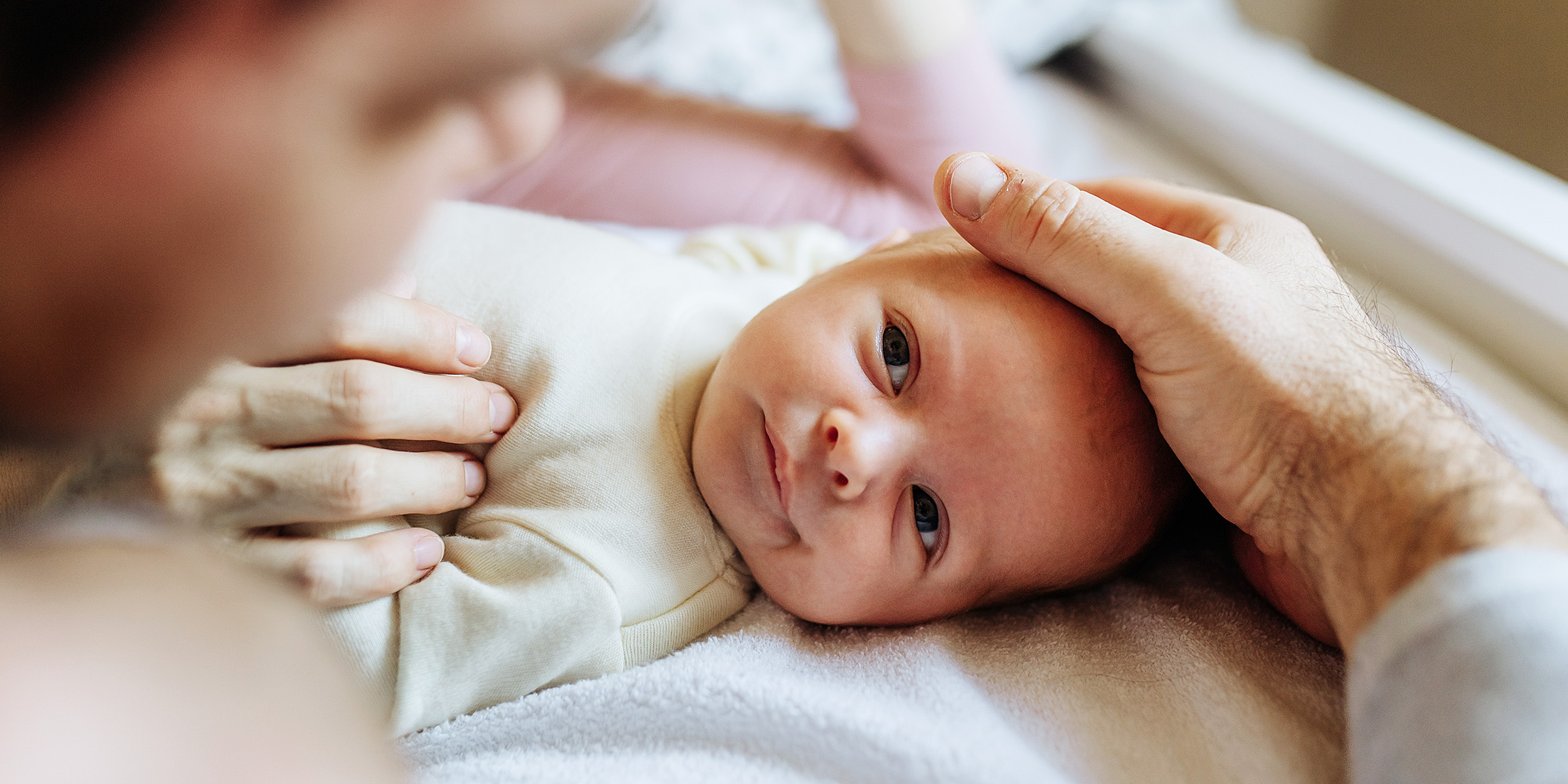 A man with his baby | Source: Shutterstock