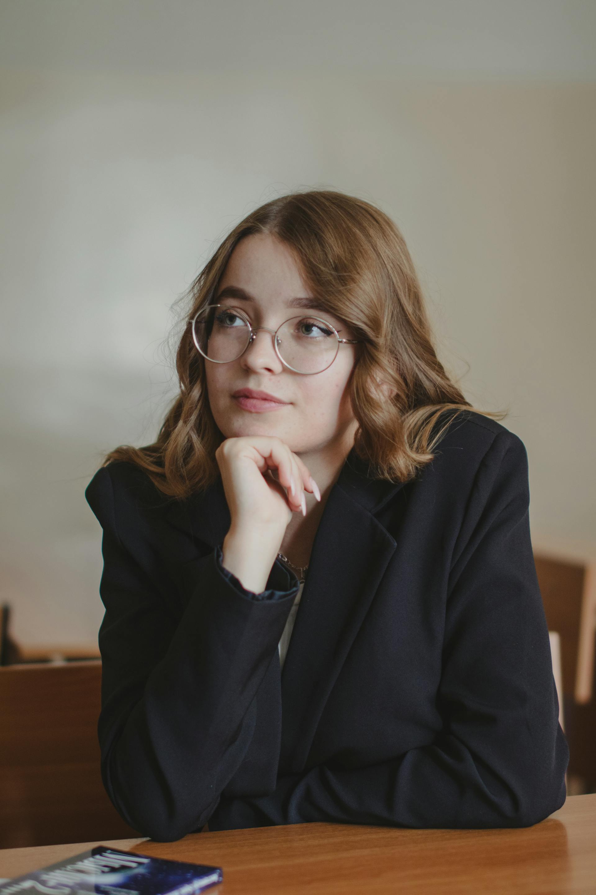 A woman in an office looking innocent | Source: Pexels