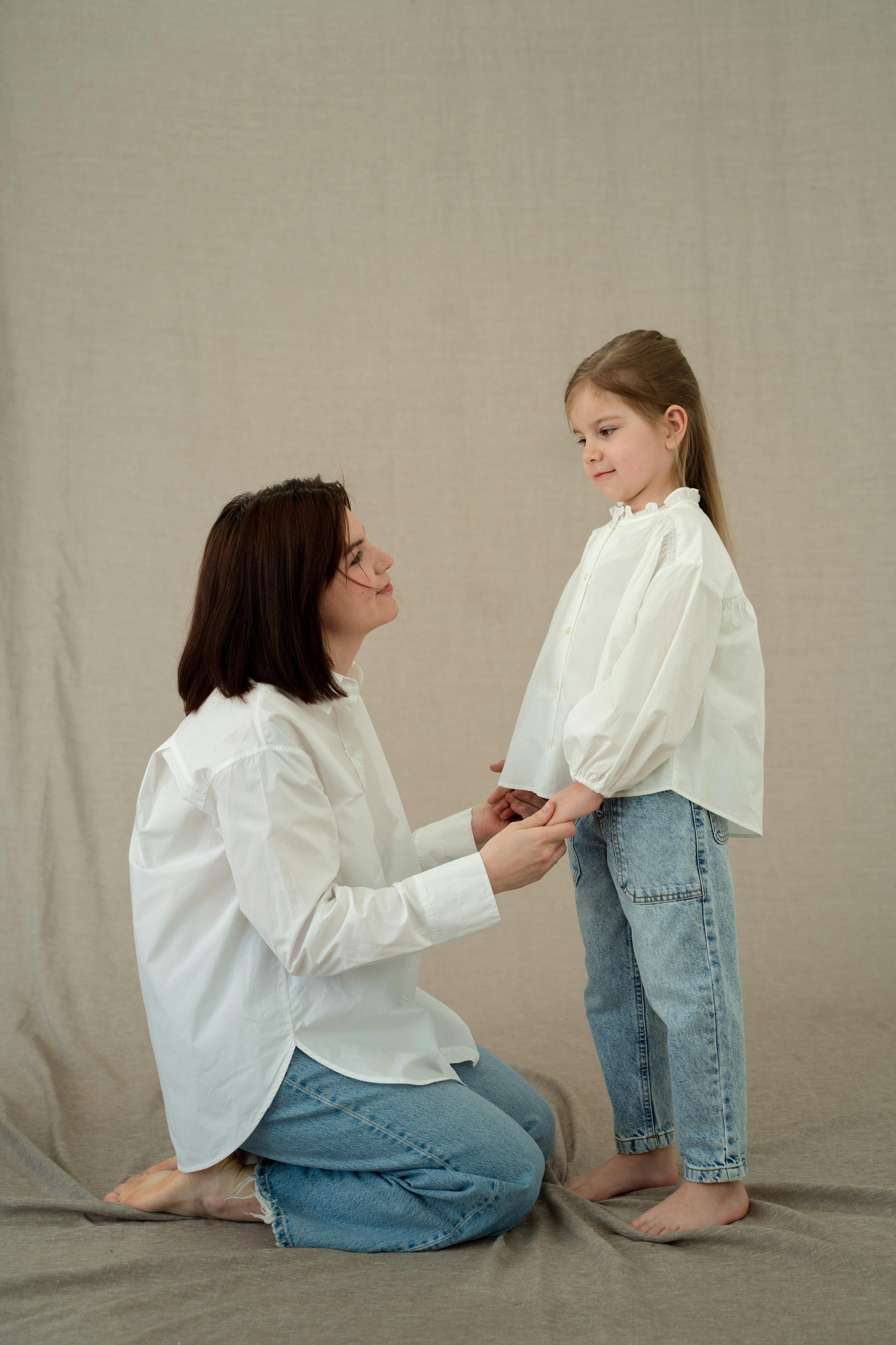 Mother and daughter wearing matching outfits | Source: Pexels