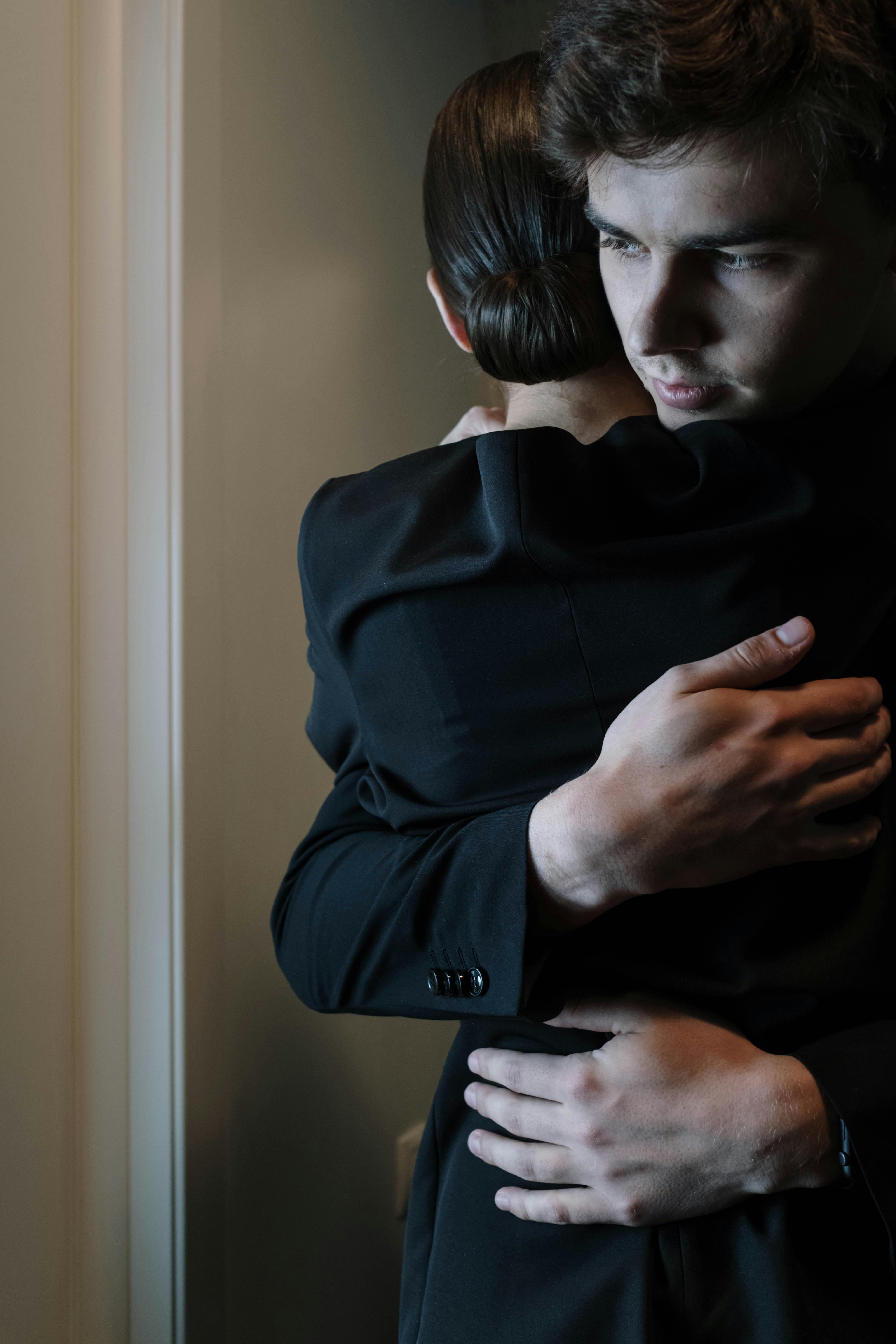 A man hugging a woman | Source: Pexels