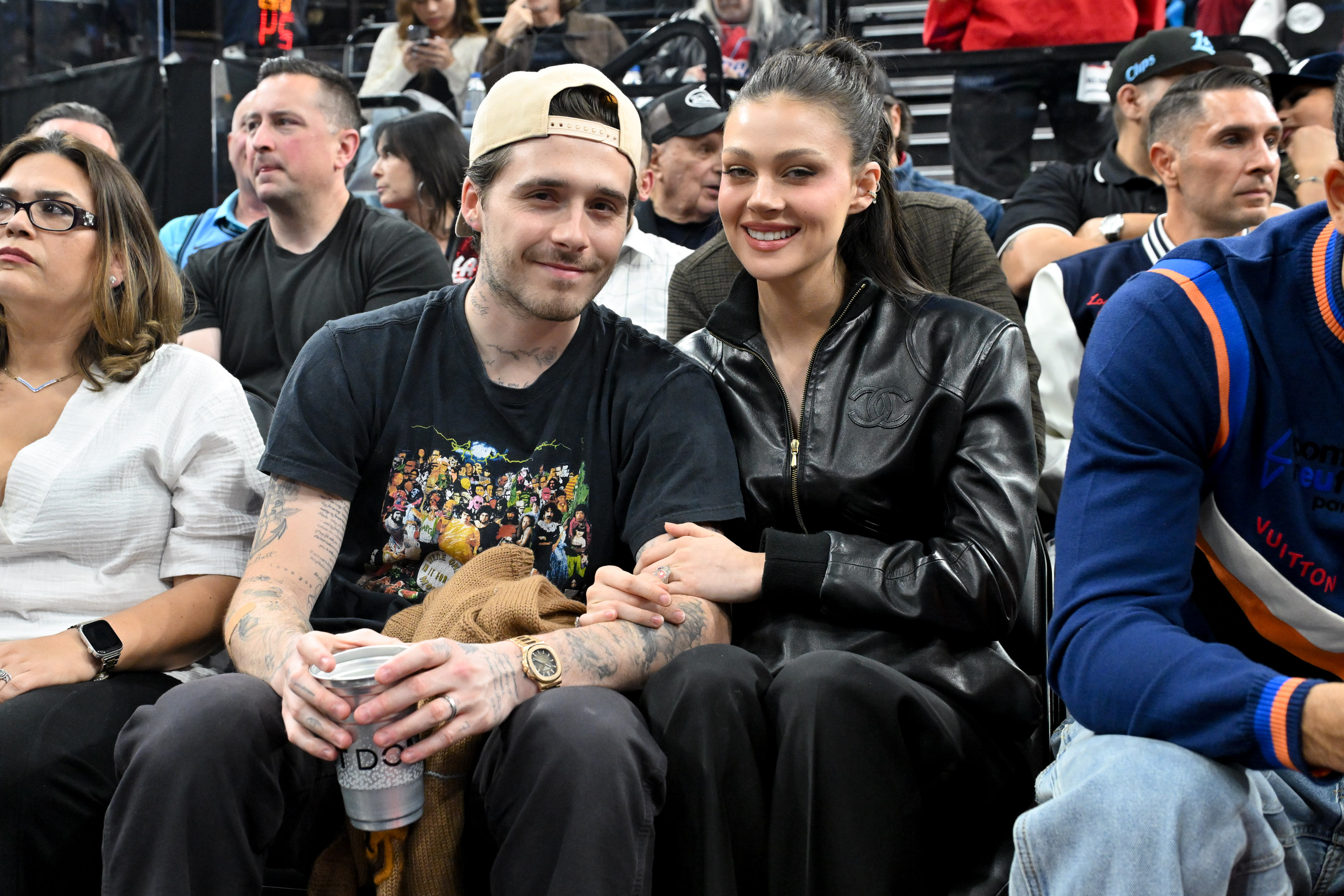 Brooklyn Beckham and Nicola Peltz attend a basketball game between the Los Angeles Clippers and the Denver Nuggets at Intuit Dome on April 24, 2025, in Inglewood, California. | Source: Getty Images
