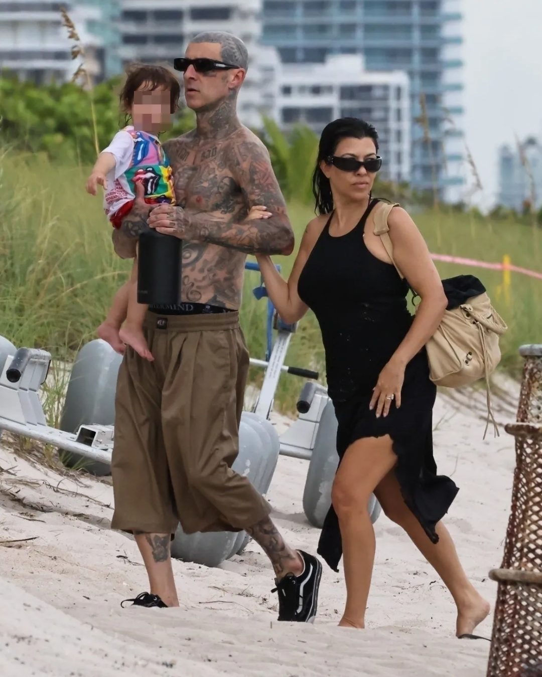 Kourtney Kardashion is seen with her husband, Travis Barker, and their son at the beach in Miami on Wednesday, August 27, 2025. | Source: Instagram/pagesix
