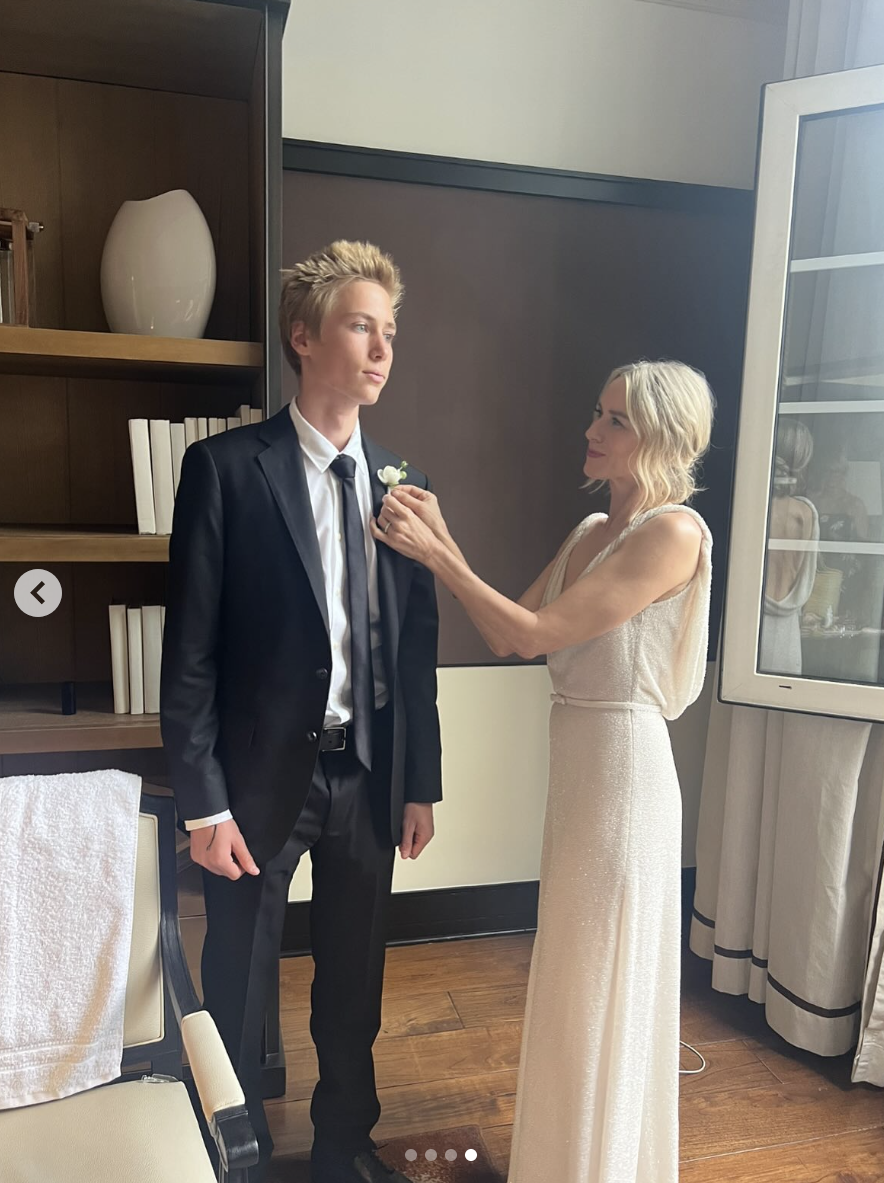 Naomi Watts putting a boutonniere on her son, Sasha Schreiber, posted on July 25, 2025. | Source: Instagram/naomiwatts