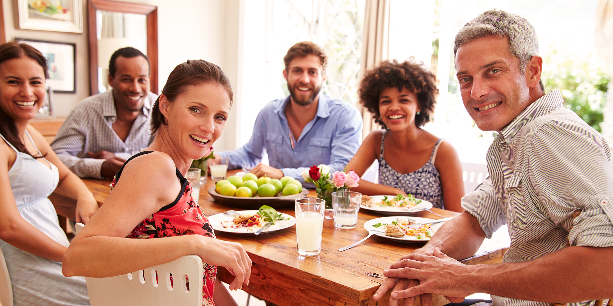 People sitting around a table | Source: Shutterstock