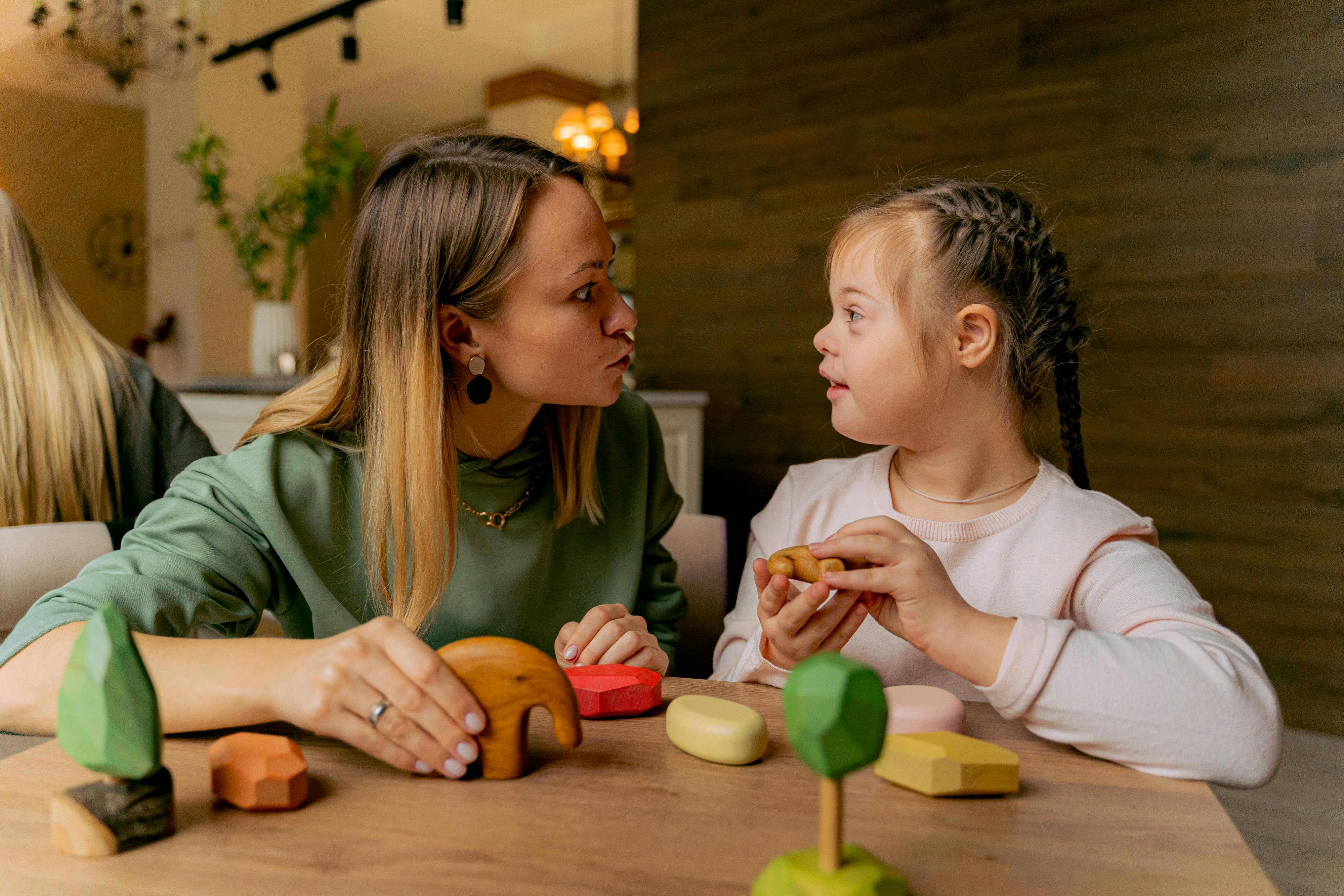 Woman playing with her daughter | Source: Pexels