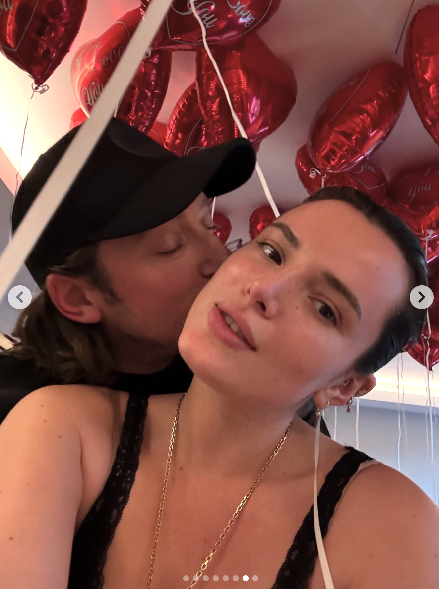 Mark Emms kisses Bella Thorne on the cheek after the actress proposed, posted on August 17, 2025. | Souce: Instagram/bellathorne