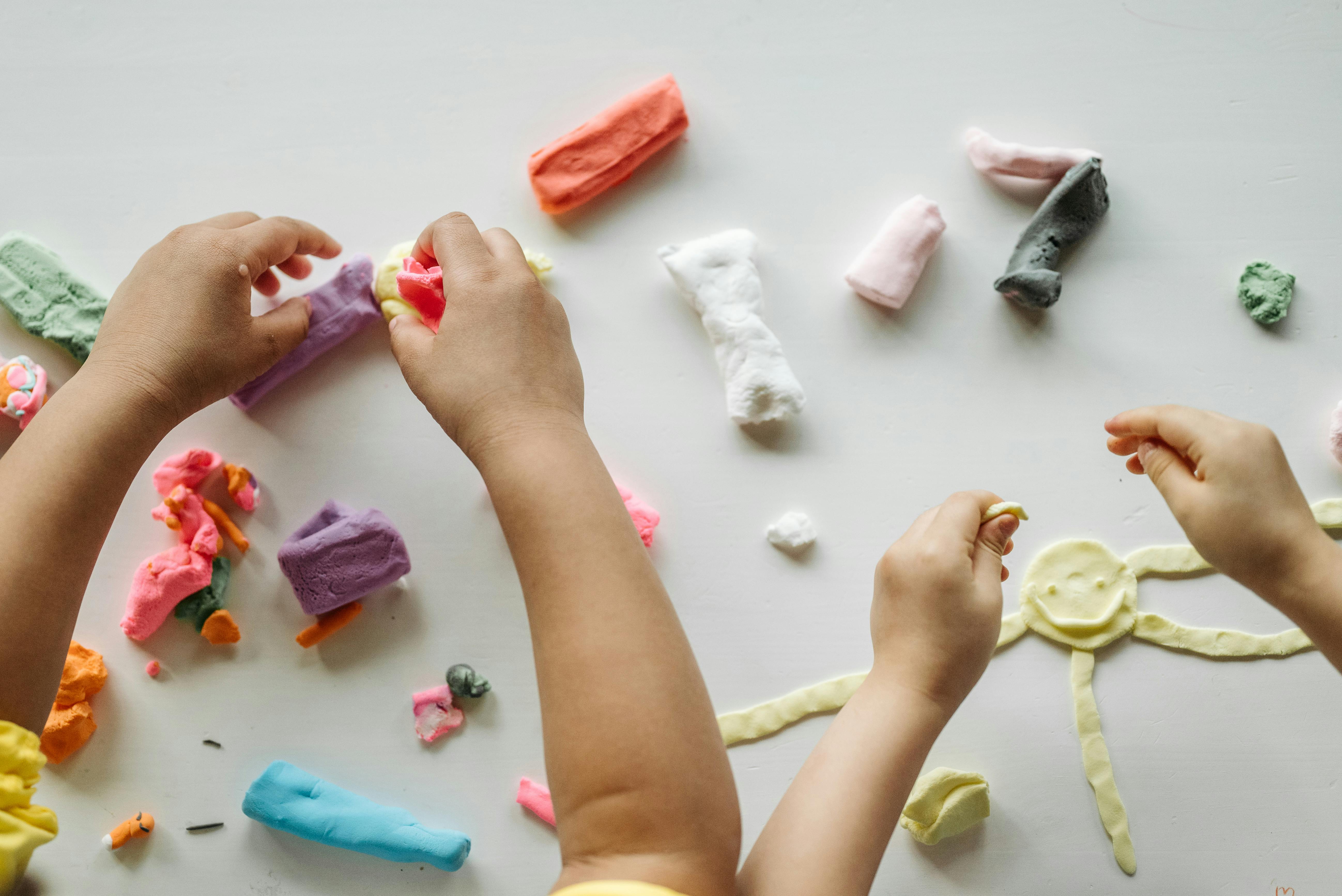 Children playing with Play-Doh | Source: Pexels