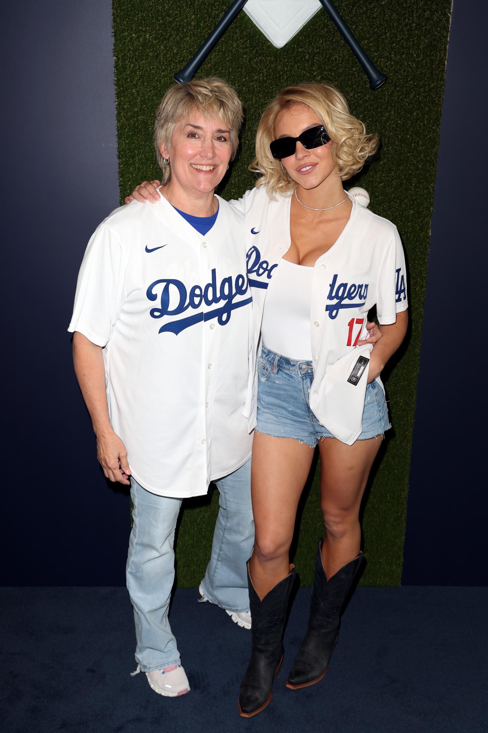 Christy Martin and Sydney Sweeney pose for a photo prior to Game Four of the 2025 World Series presented by Capital One between the Toronto Blue Jays and the Los Angeles Dodgers at Dodger Stadium on Tuesday, October 28, 2025, in Los Angeles, California. | Source: Getty Images