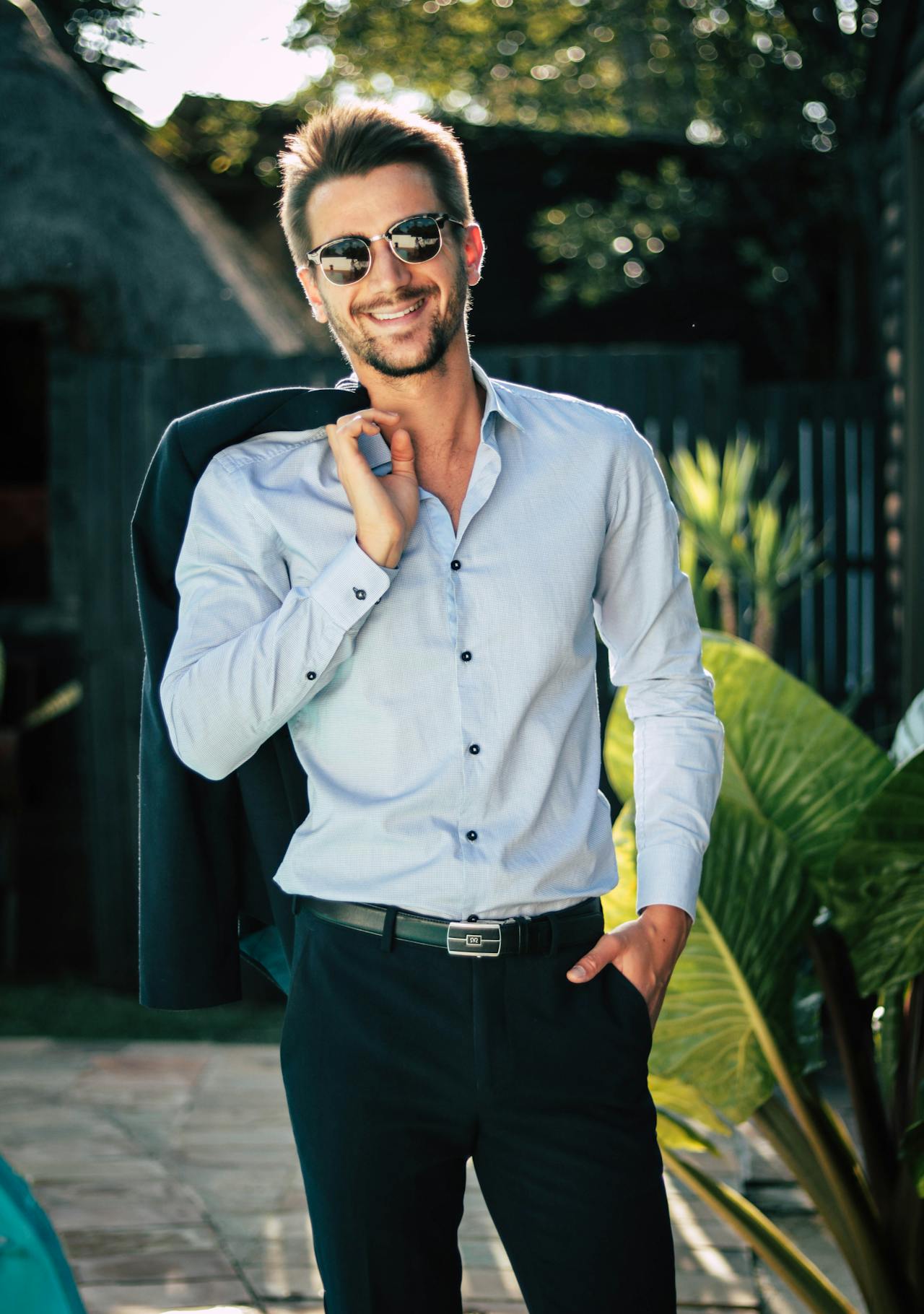 My Sister Made Me Eat in the Garage at Her Wedding Because 'There Wasn't Enough Space for Everyone Inside' 14 A man smiling | Source: Pexels