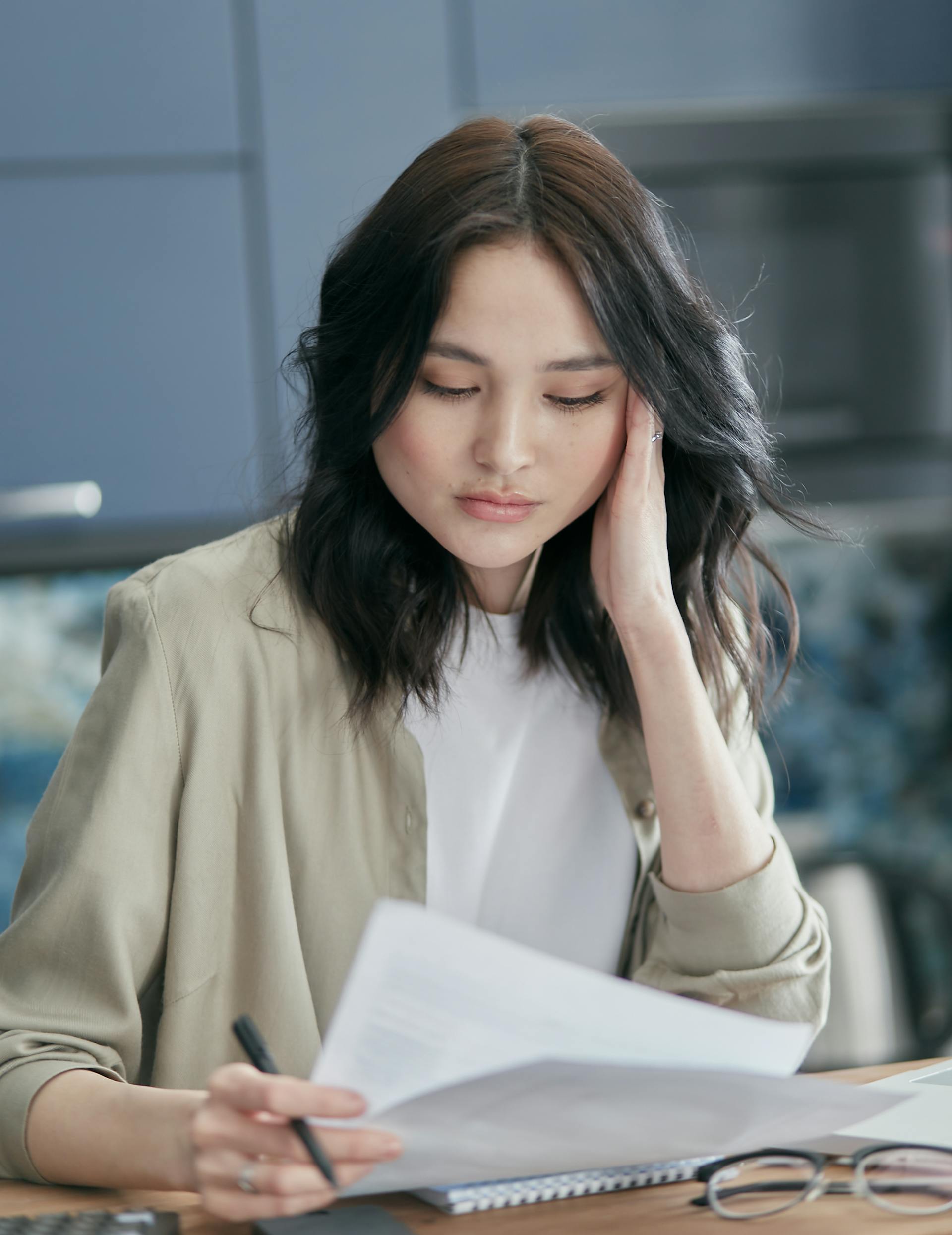 A woman staring at a bill | Source: Pexels