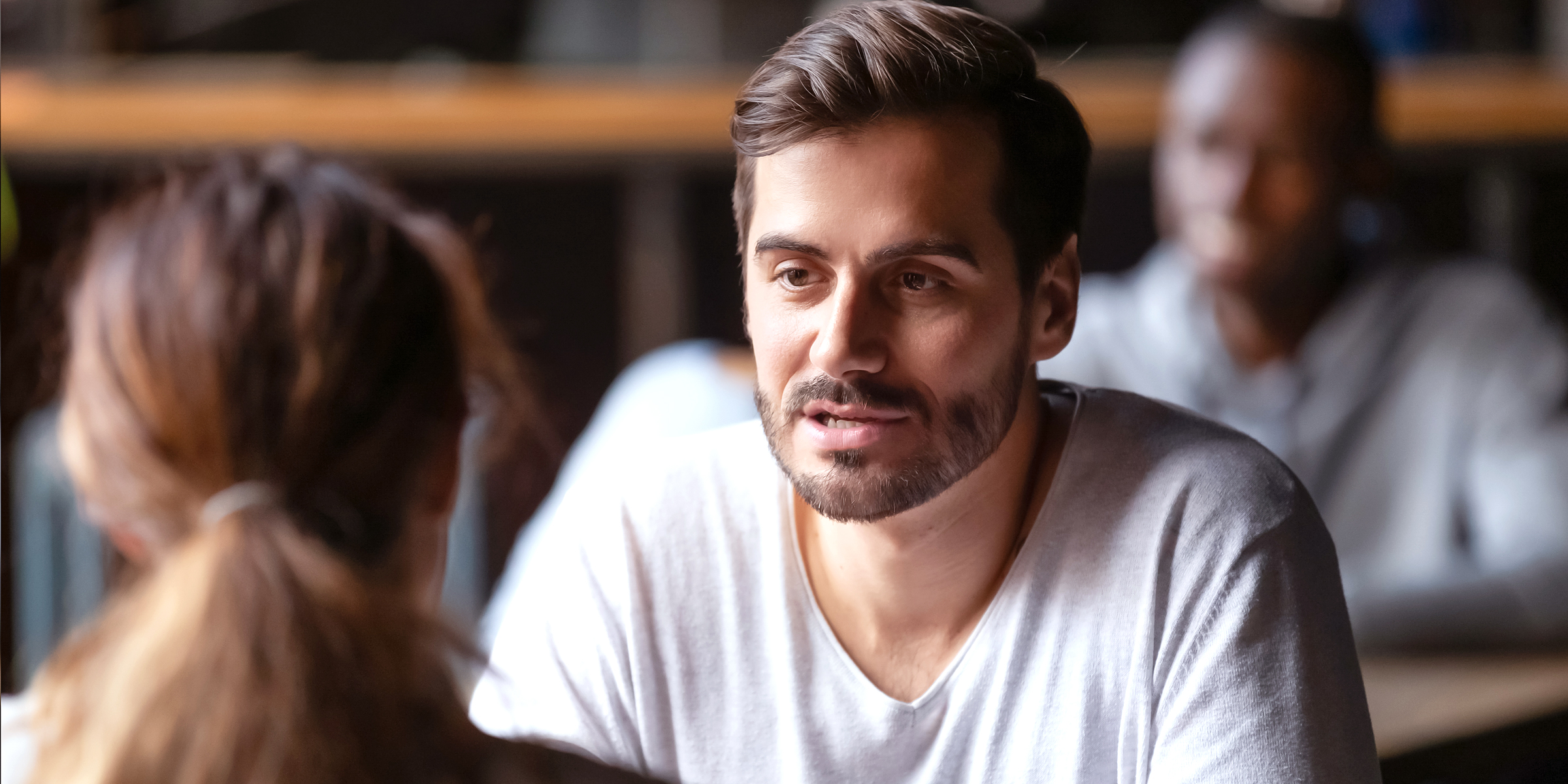 A man talking to a woman | Source: Shutterstock