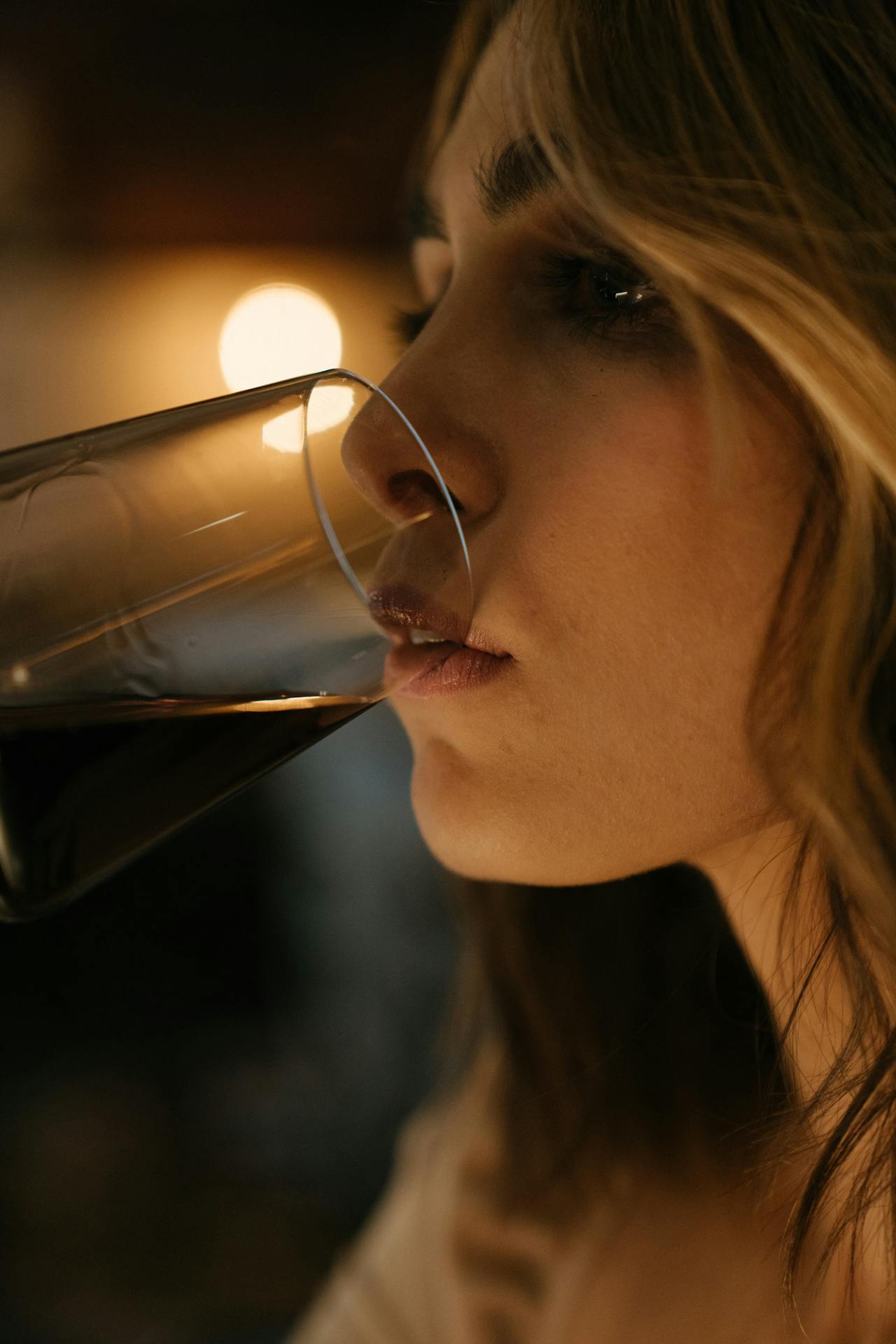 A woman drinking a glass of wine | Source: Pexels