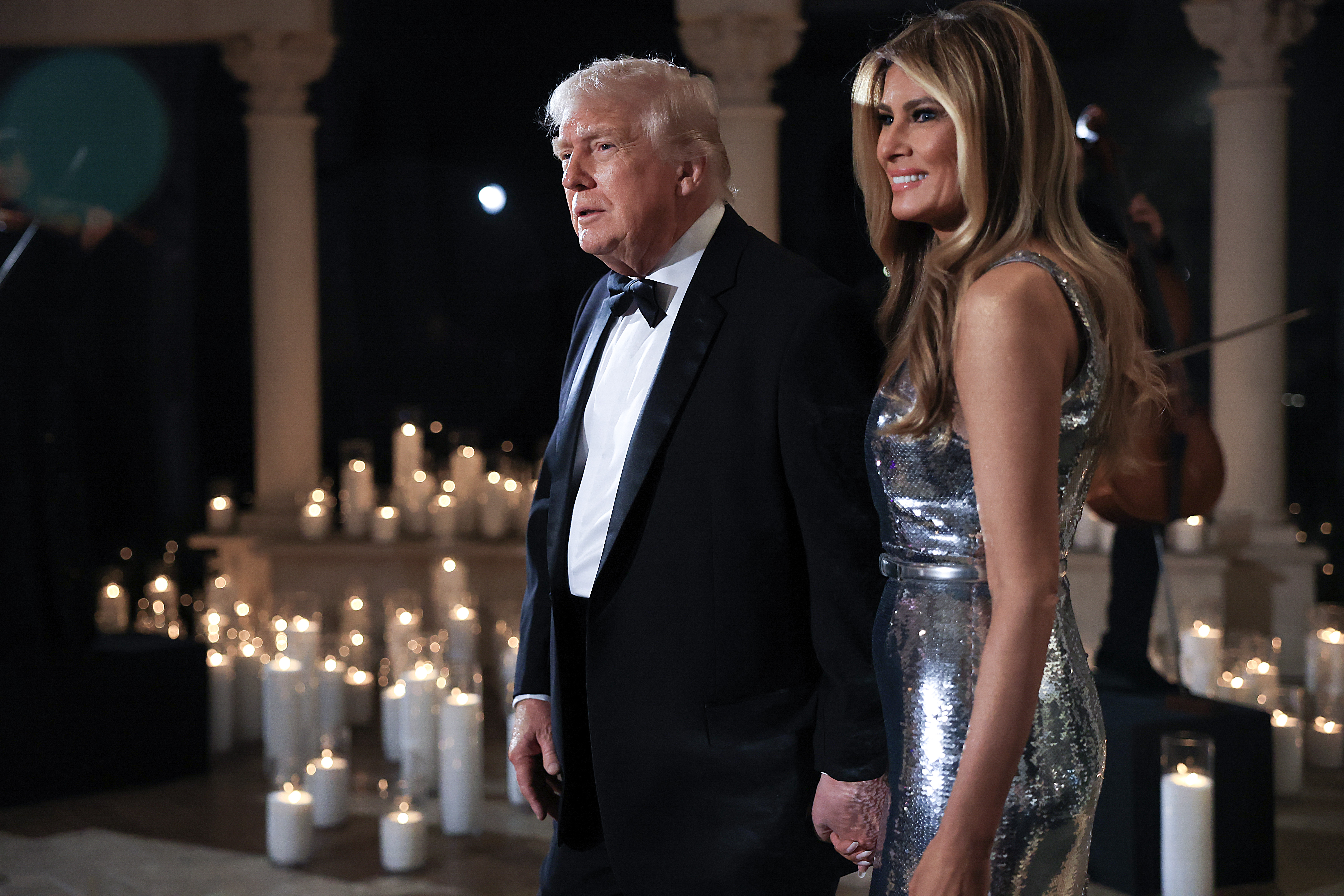 U.S. President Donald Trump and first lady Melania Trump arrive for a New Year’s Eve event at his Mar-a-Lago home on December 31, 2025 in Palm Beach, Florida. | Source: Getty Images