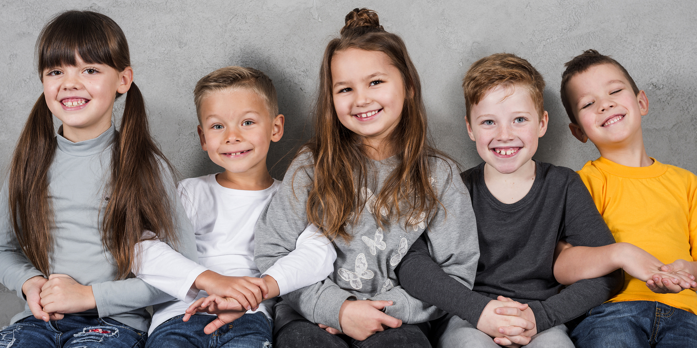 Five kids sitting together | Source: Freepik