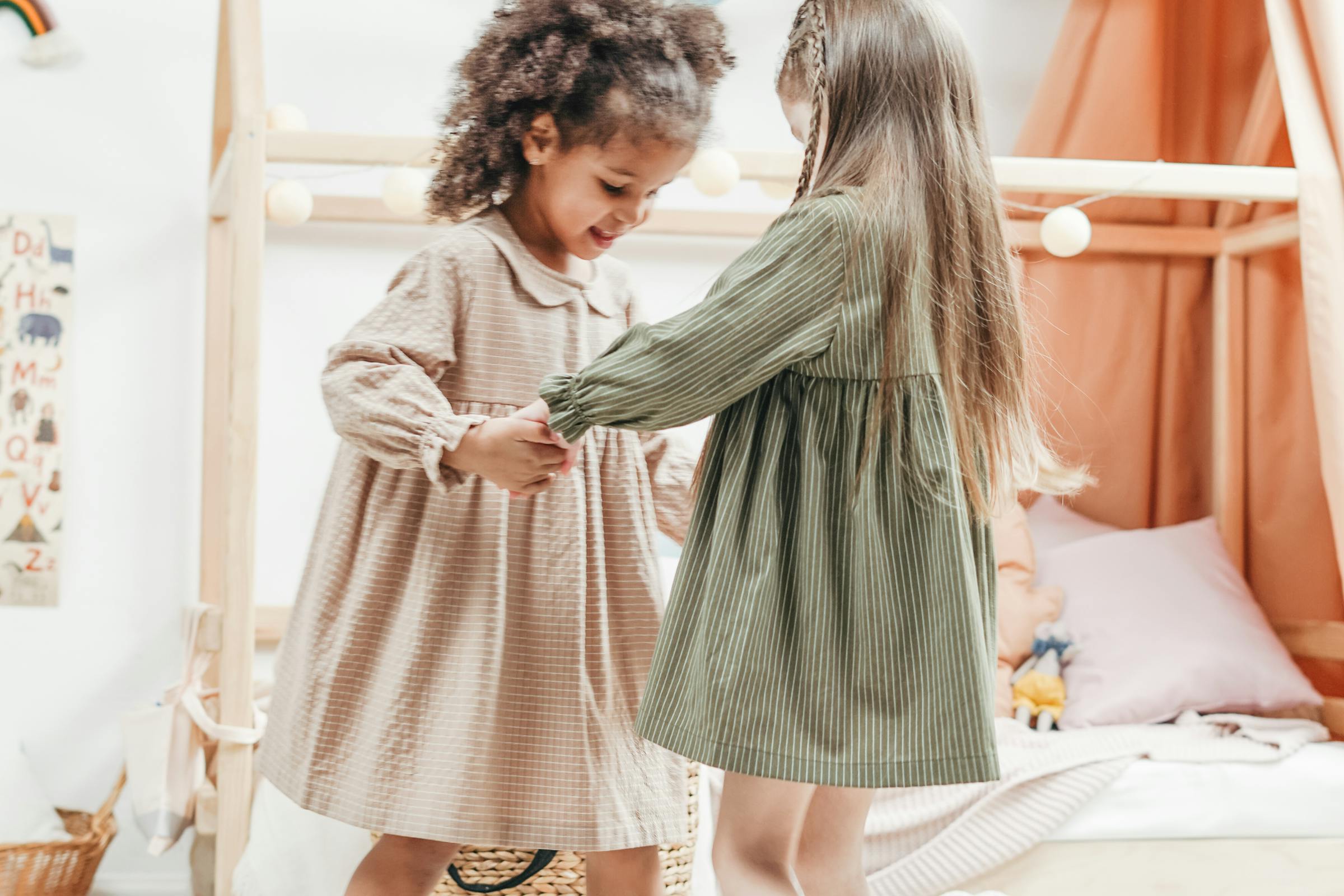 Two little kids playing together as friends | Source: Pexels