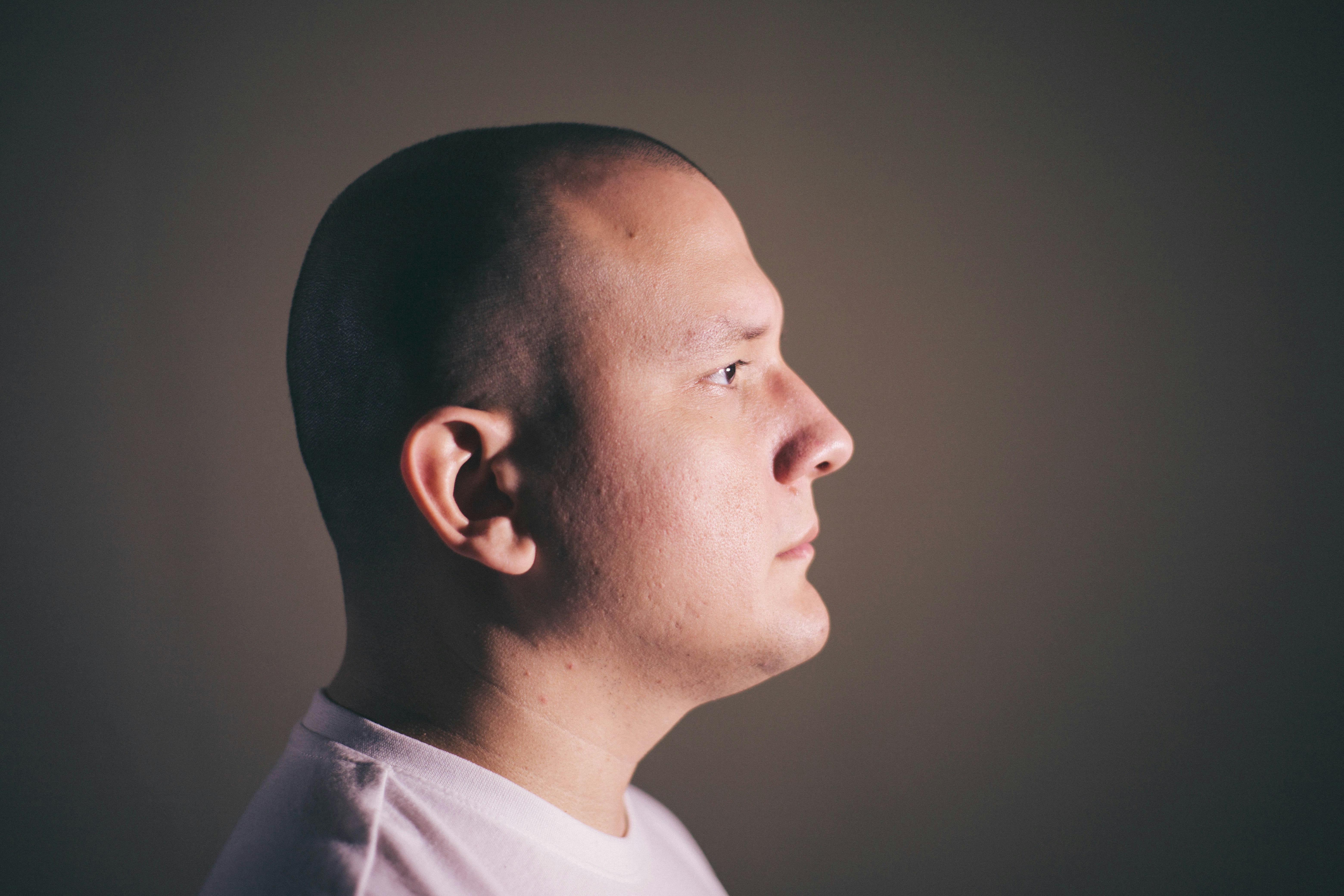 A side view of a pensive man | Source: Unsplash