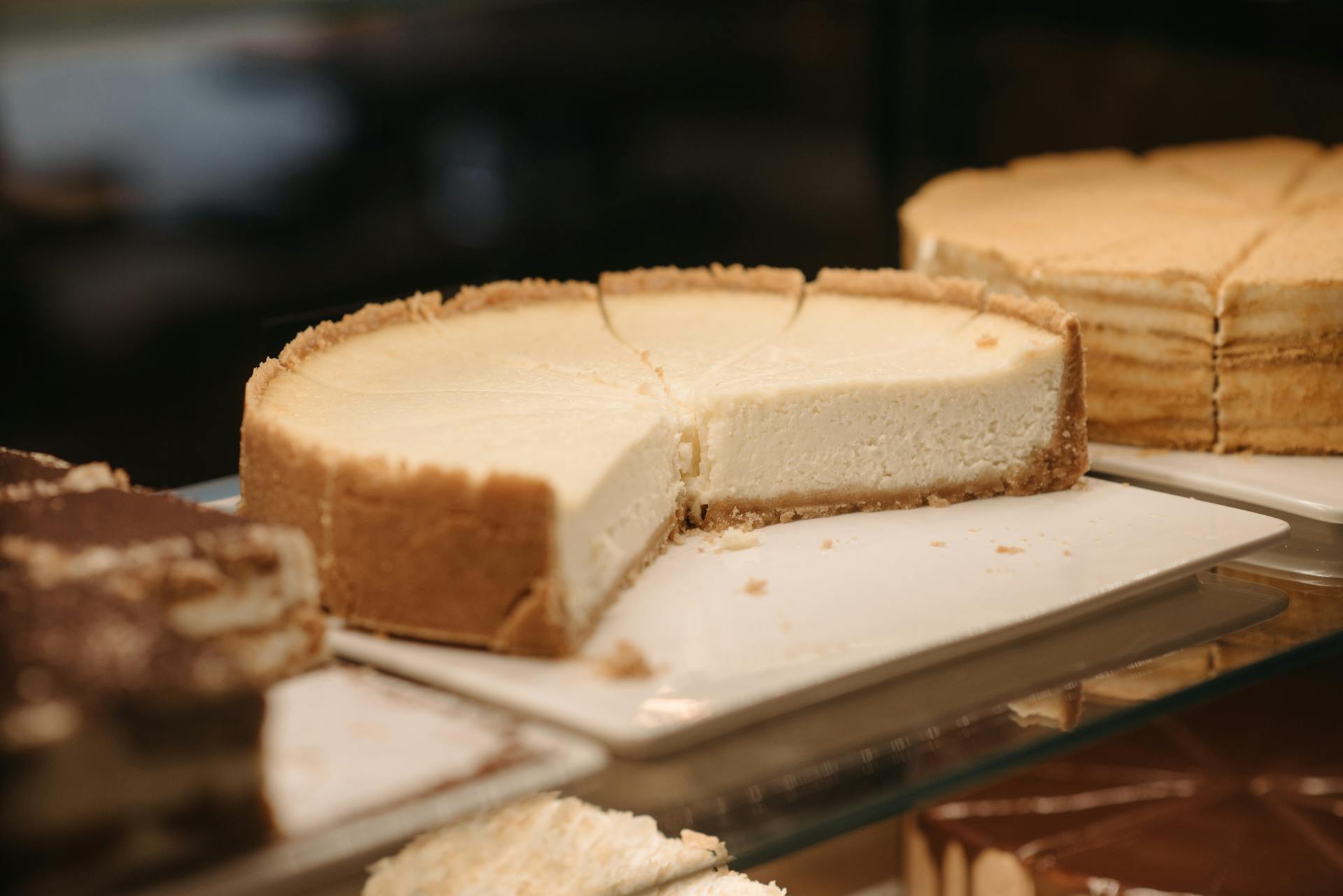 Cakes displayed on a glass shelf | Source: Pexels