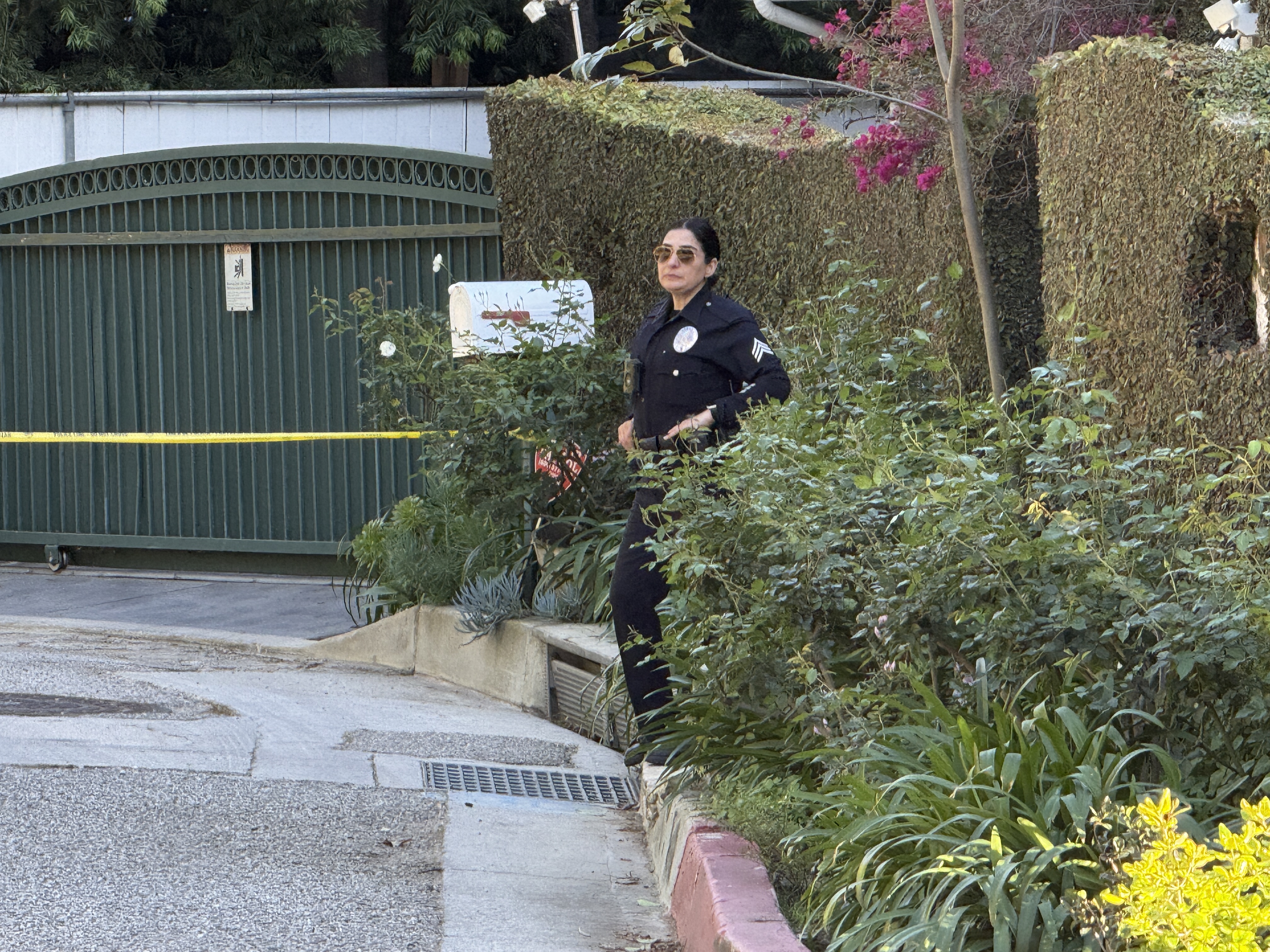 A police officer is seen outside Rihanna's home after a report of gunshots on March 08, 2026 in Beverly Hills, California. | Source: Getty Images
