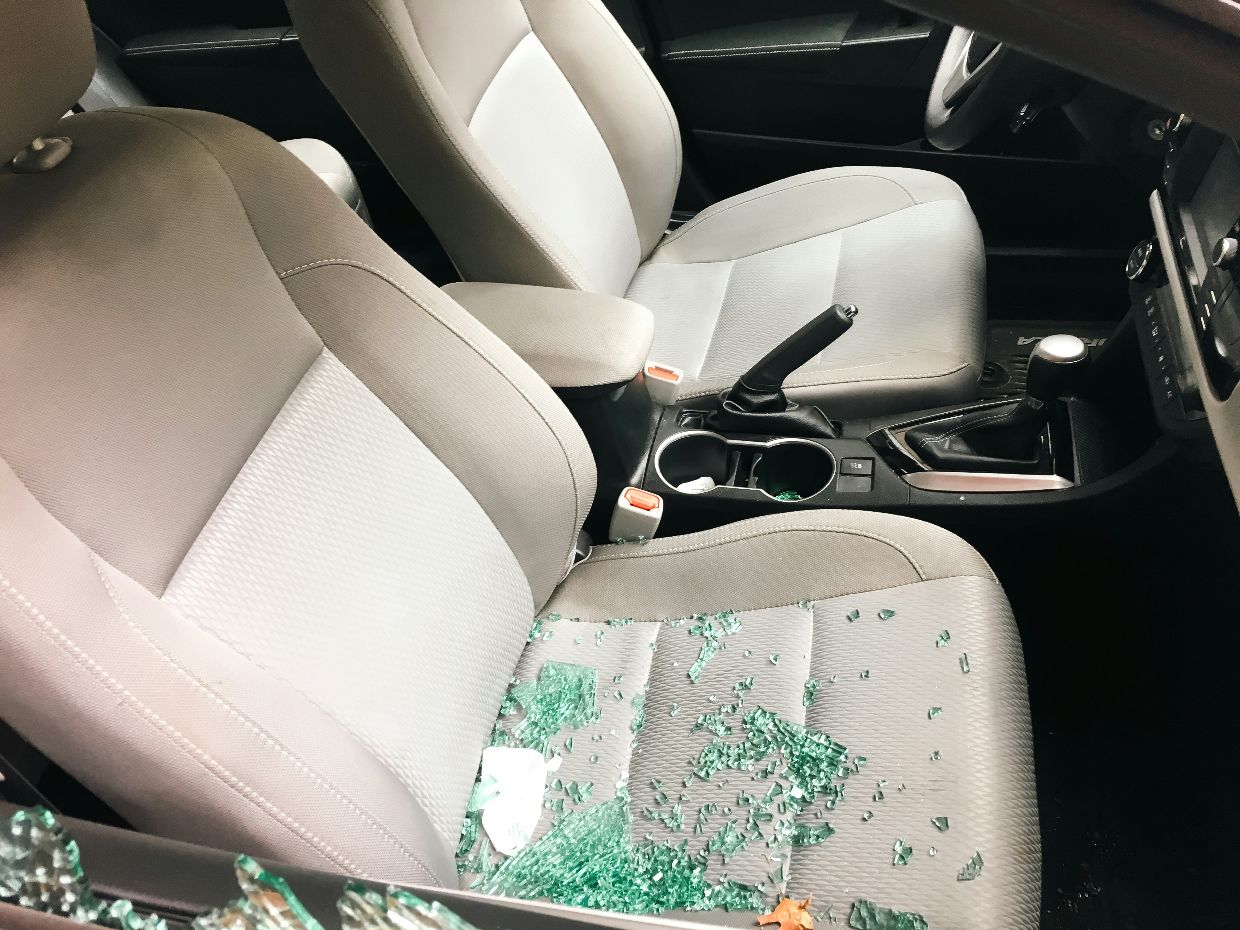 Shattered glass from a window on a car seat | Source: Unsplash