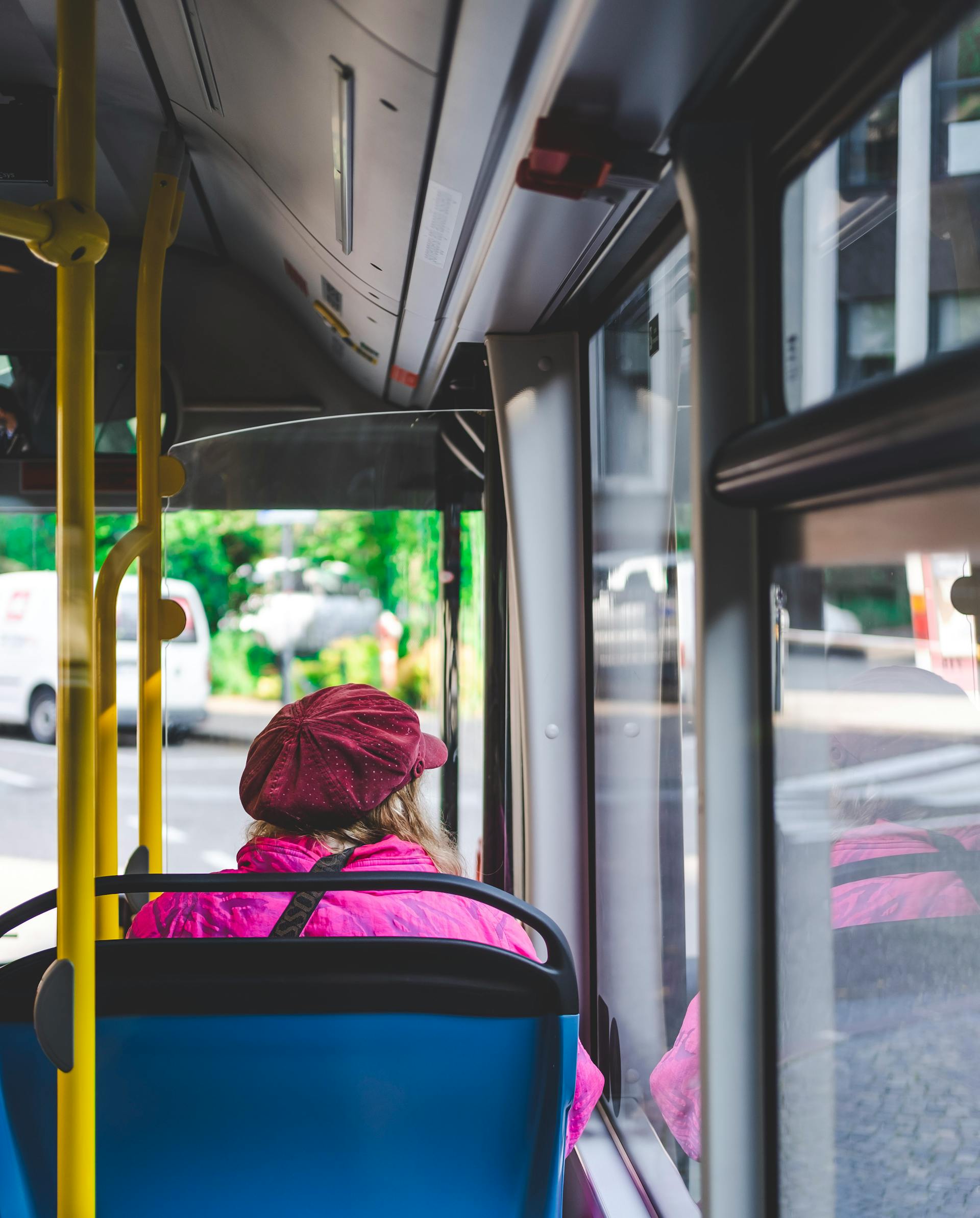 A woman staring out a bus window | Source: Pexels