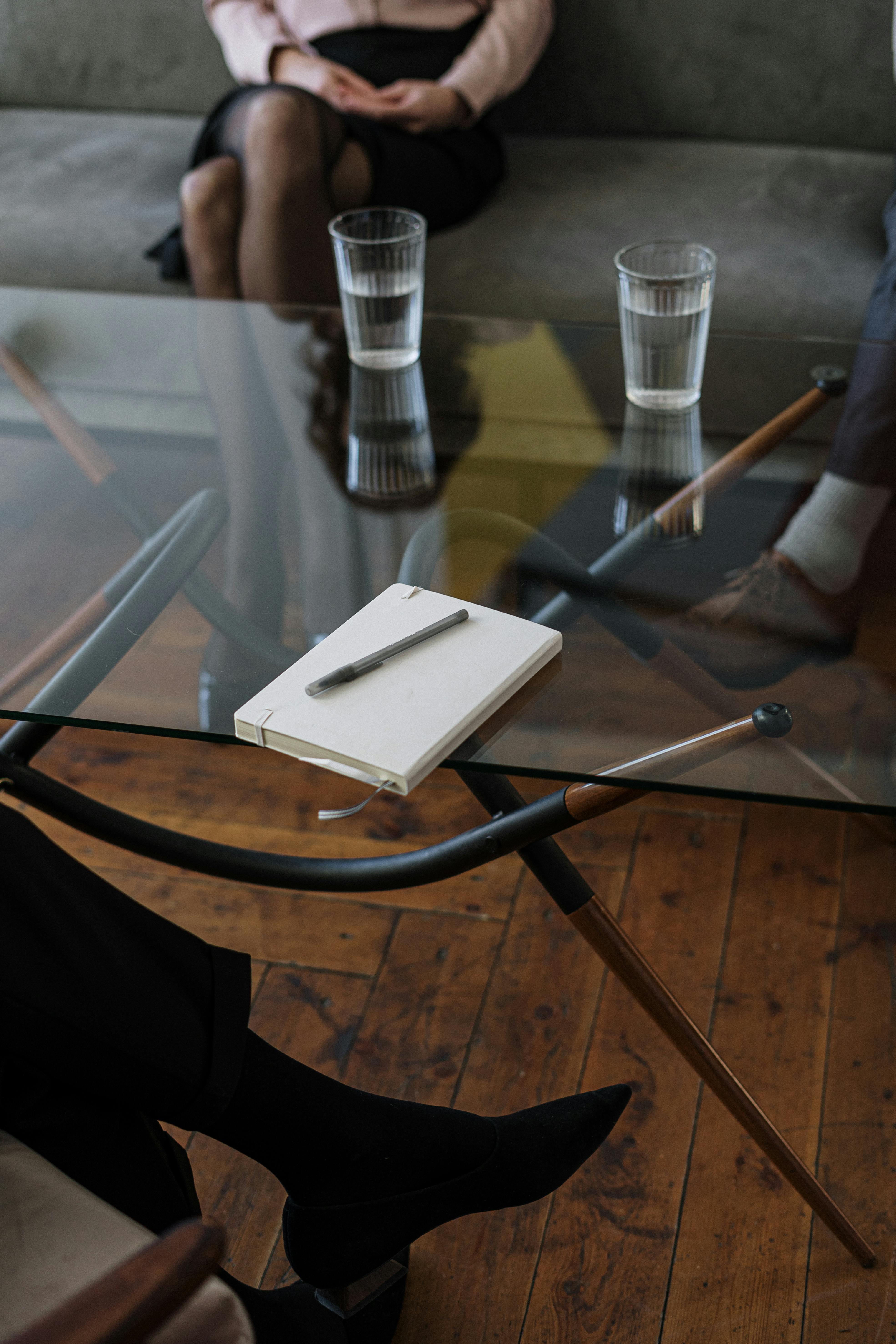 A person sitting on a couch during a therapy session | Source: Pexels