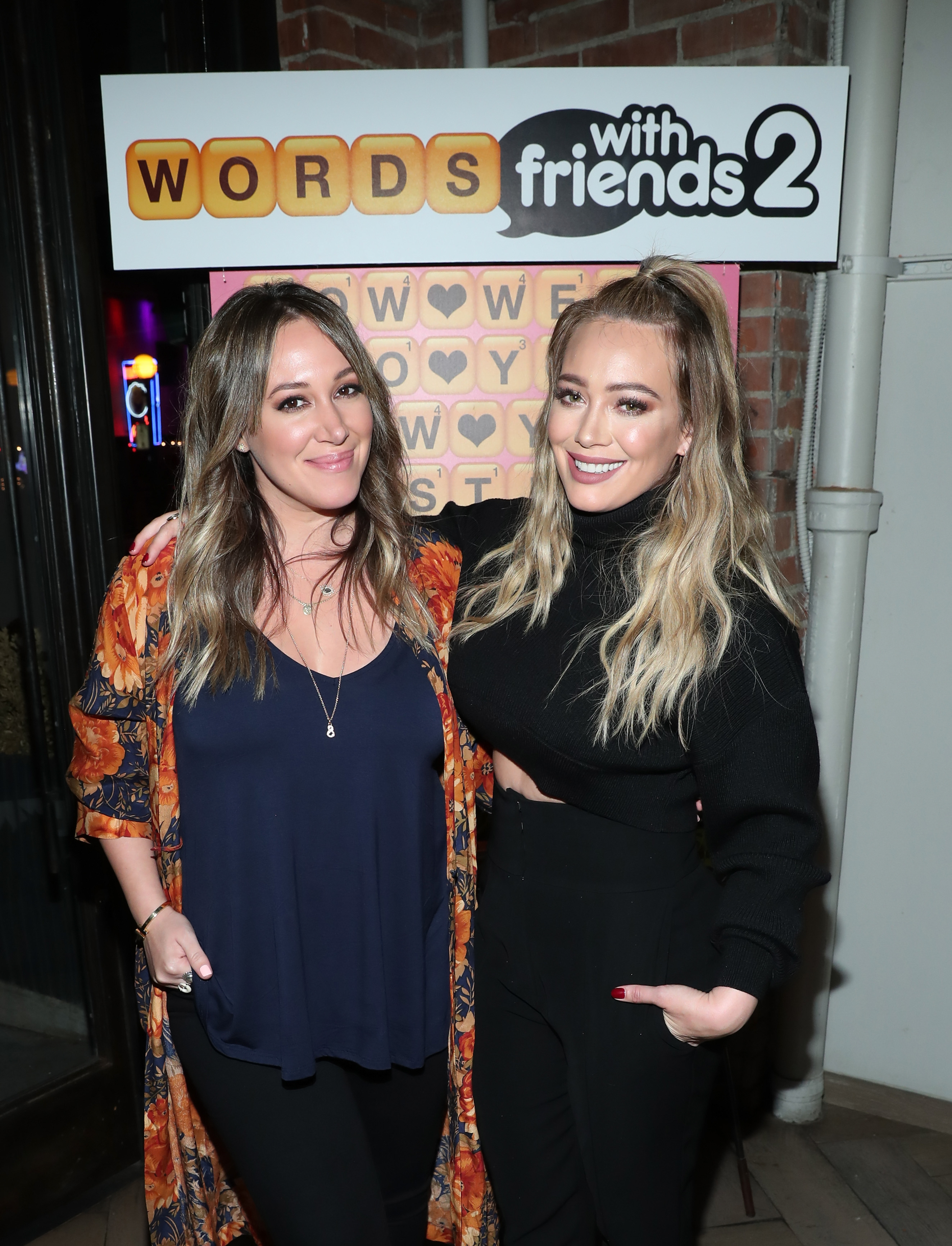 Haylie and Hilary Duff attend the Launch of Words with Friends 2 hosted by Hilary and Haylie Duff at Norah Restaurant on November 9, 2017 in West Hollywood, California. | Source: Getty Images
