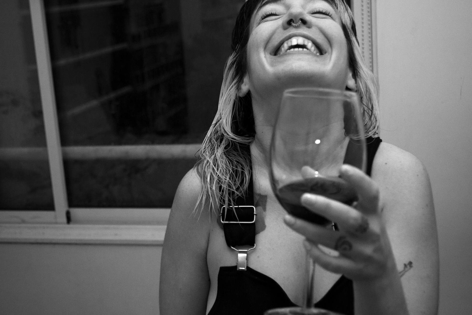 A happy woman toasting | Source: Pexels