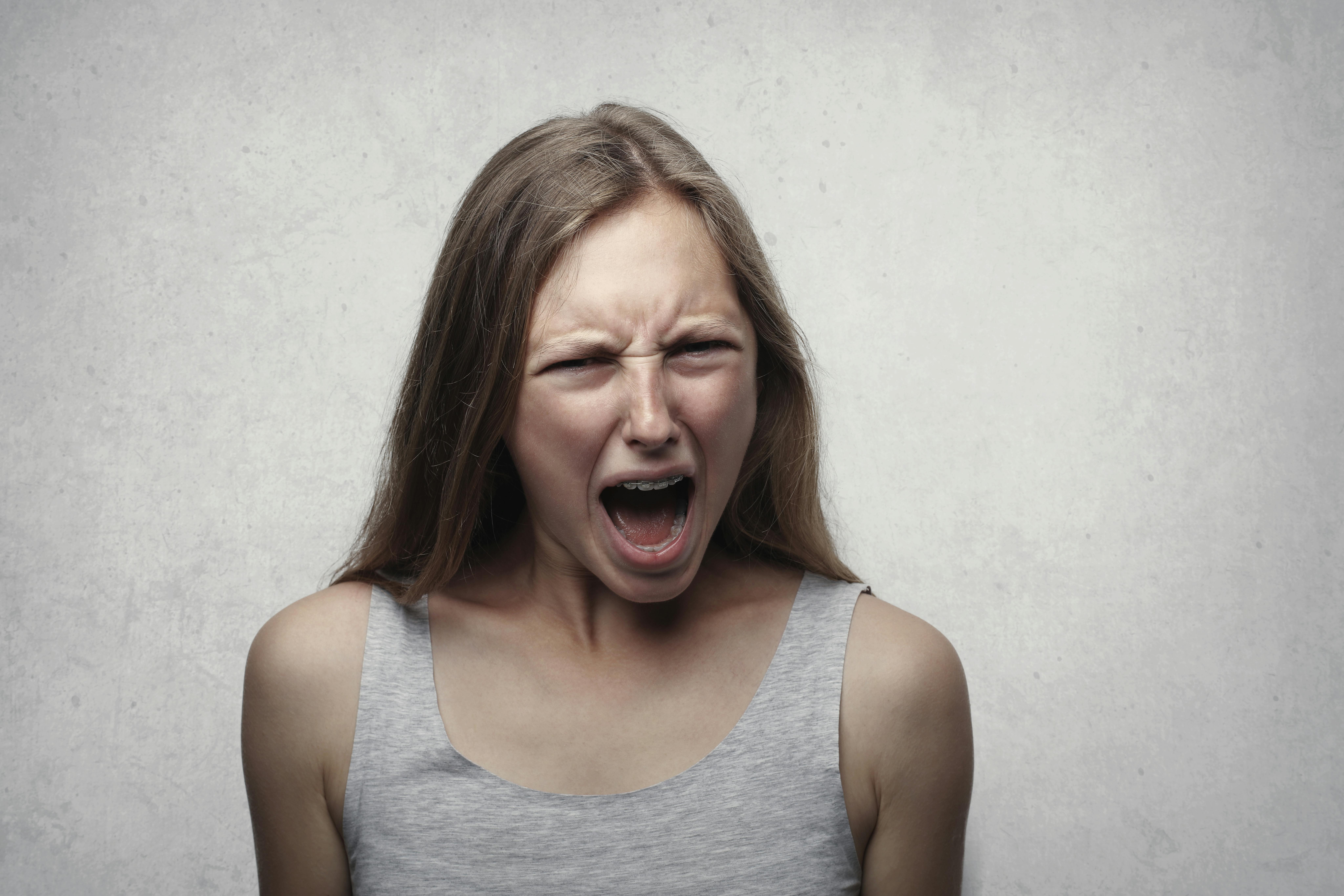 A woman standing with her mouth open | Source: Pexels