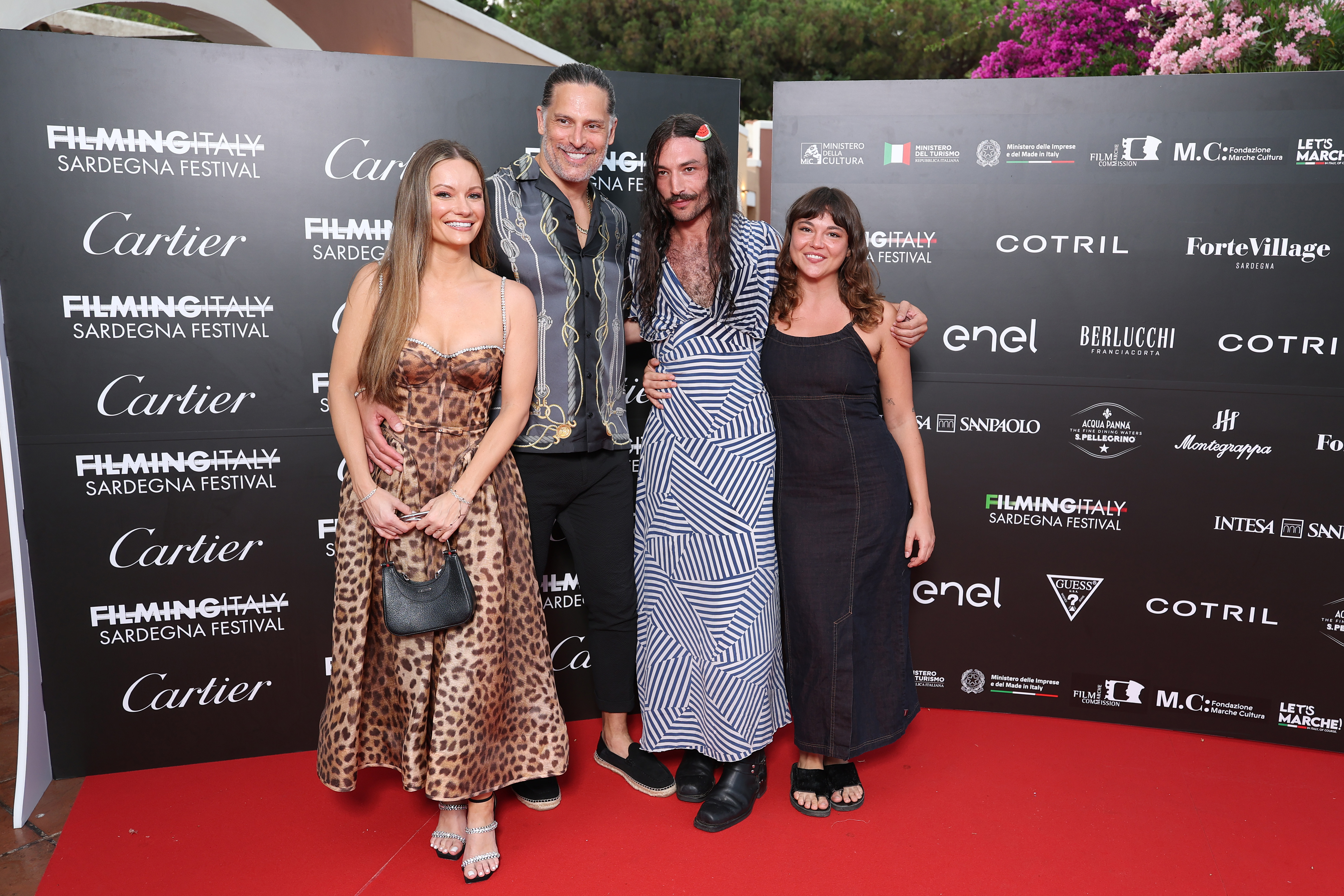 Caitlin O'Connor, Joe Manganiello, Ezra Miller and Milla-Alexia Gojkovic attend the Filming Italy 2025 red carpet at Forte Village Resort on June 21, 2025, in Santa Margherita di Pula, Italy. | Source: Getty Images