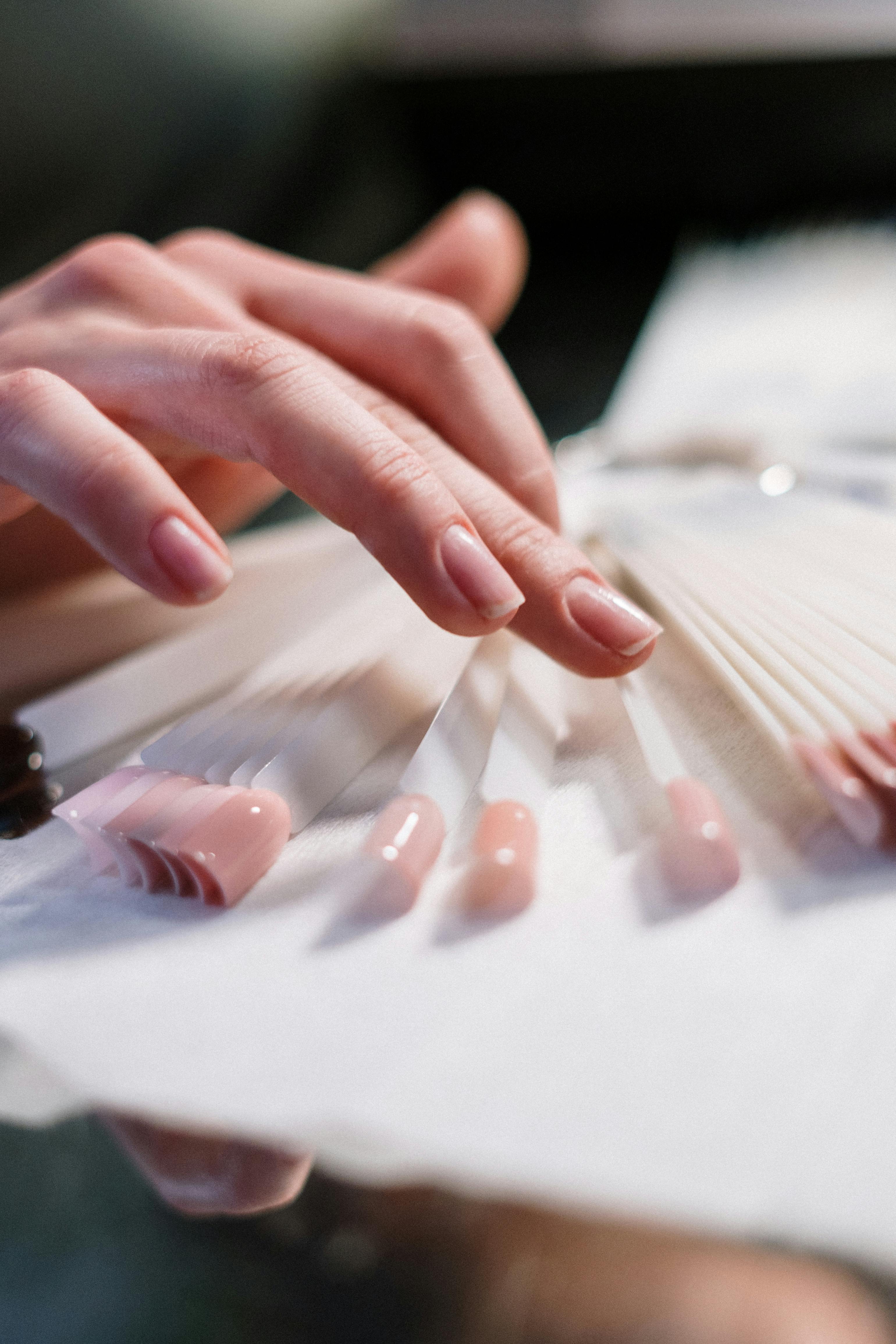 A person choosing a nail color | Source: Pexels