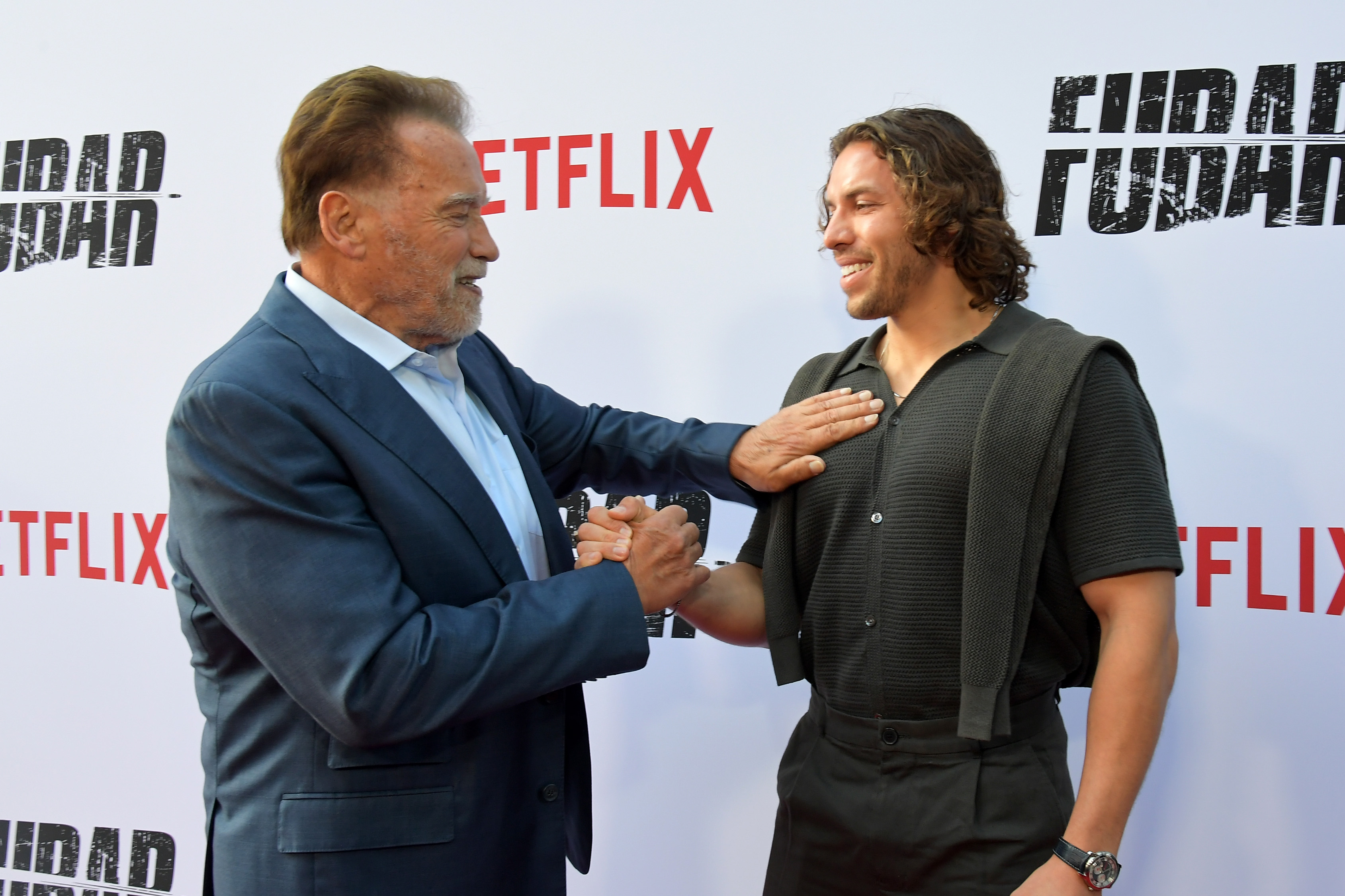 Arnold Schwarzenegger and Joseph Baena attend Netflix's Los Angeles premiere of "FUBAR" Season 2 at Netflix Tudum Theater on June 11, 2025, in Los Angeles, California. | Source: Getty Images