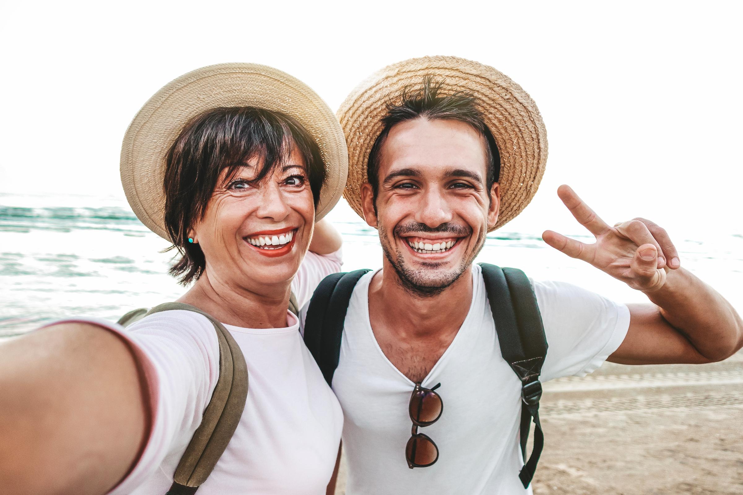 A mother-son duo click a selfie during their vacation | Source: Shutterstock