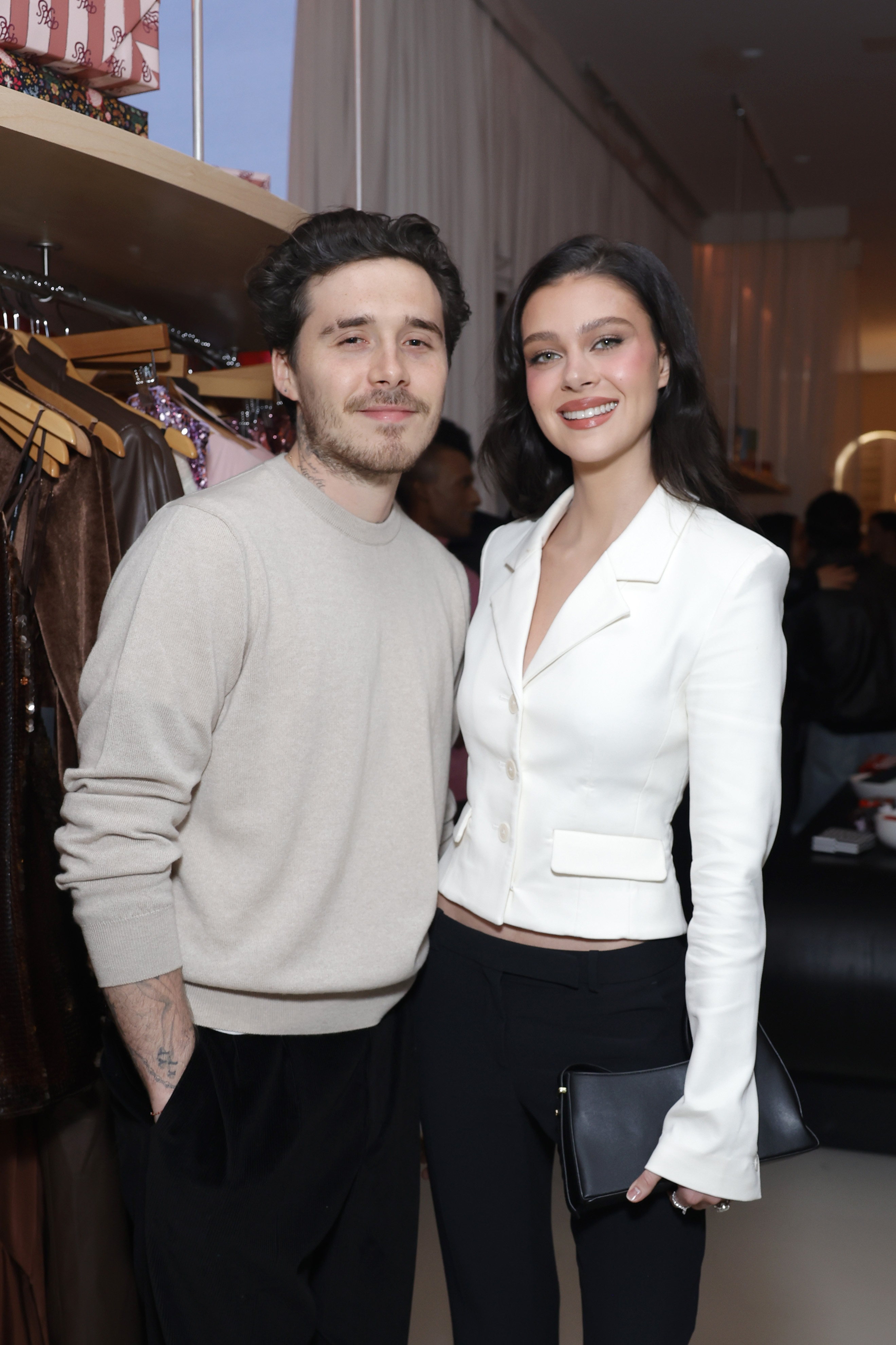 Brooklyn Beckham and Nicola Peltz attend Revolve's Holiday Shop Grand Opening at The Grove on November 14, 2024, in Los Angeles, California. | Source: Getty Images