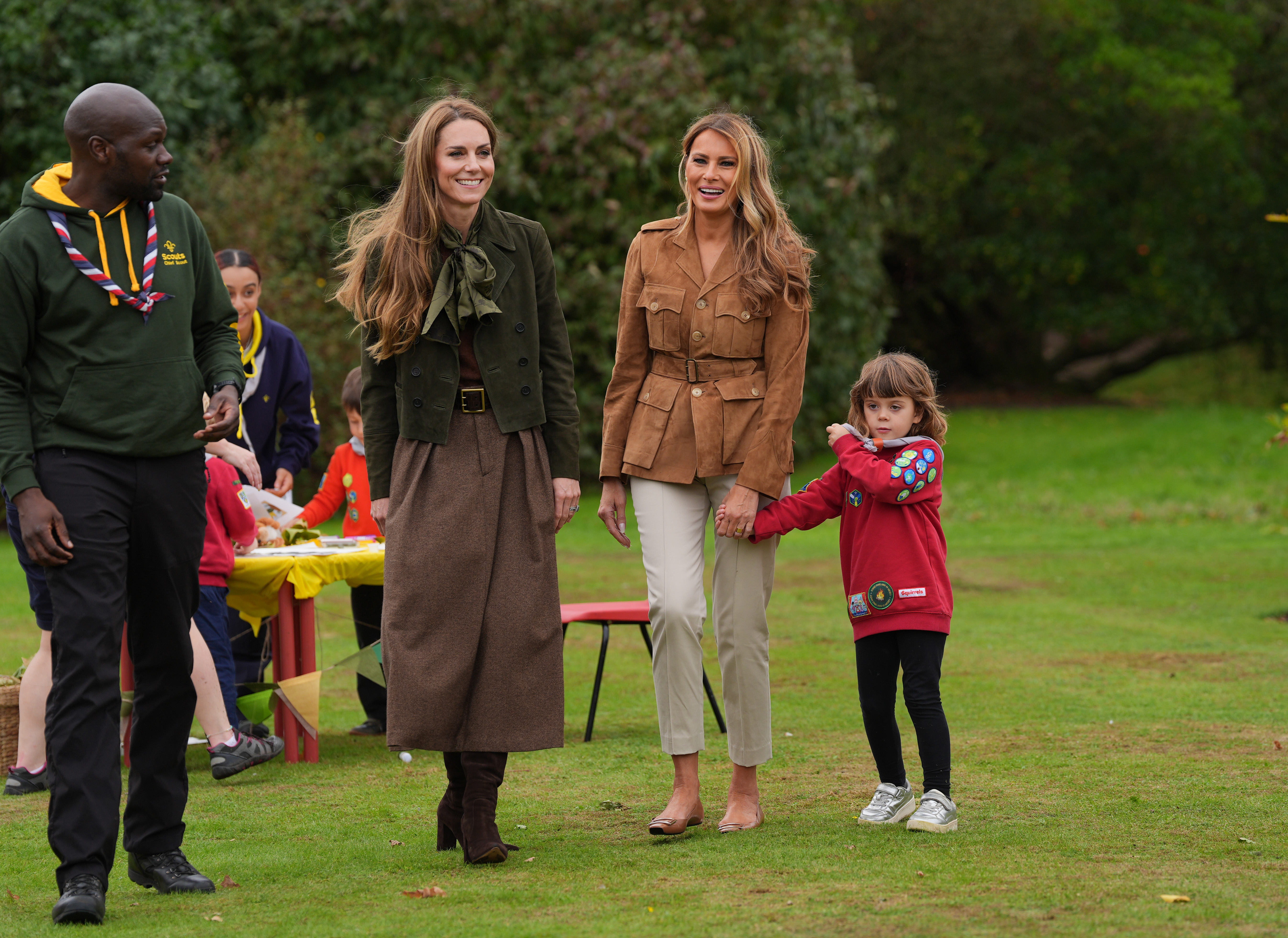 U.S. First Lady Melania Trump (R) and Catherine, Princess of Wales interact with children as they tour the grounds of Frogmore Cottage where they met members of the Scouts' Squirrels programme, during the State visit by the President of the United States of America and U.S. First Lady Melania Trump, on September 18, 2025, in Windsor, England. | Source: Getty Images
