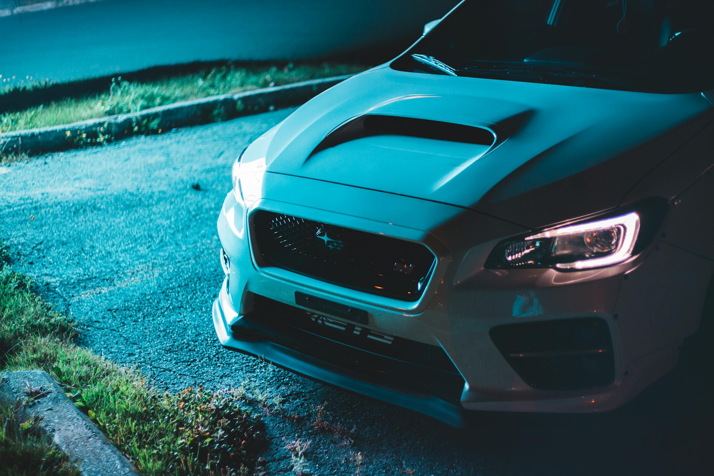 A car on a driveway at night | Source: Pexels