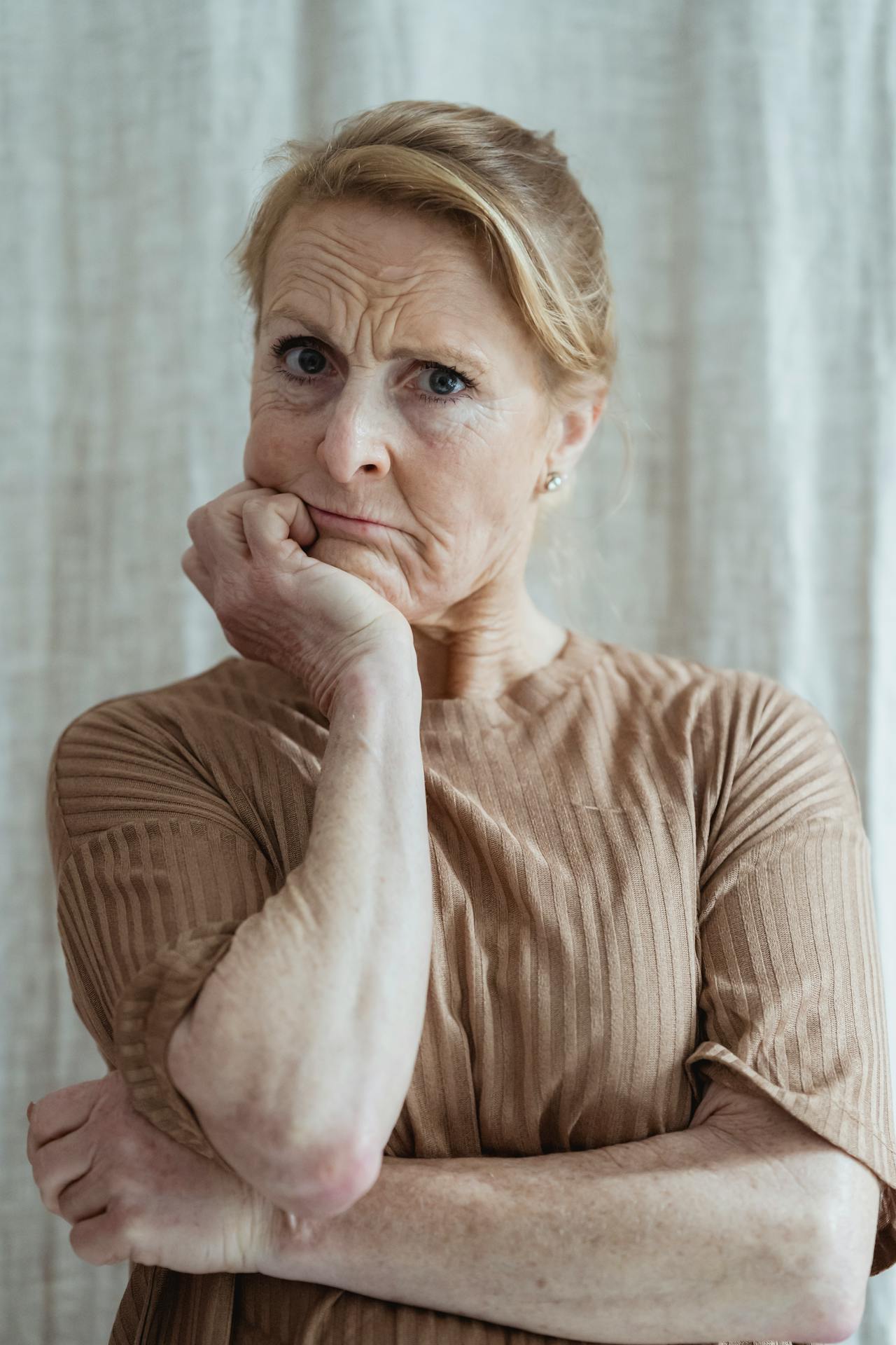 My Daughter Told Me Not to Visit Her Family Again — Days Later, She Was at My Door Begging 10 A senior woman staring at someone | Source: Pexels