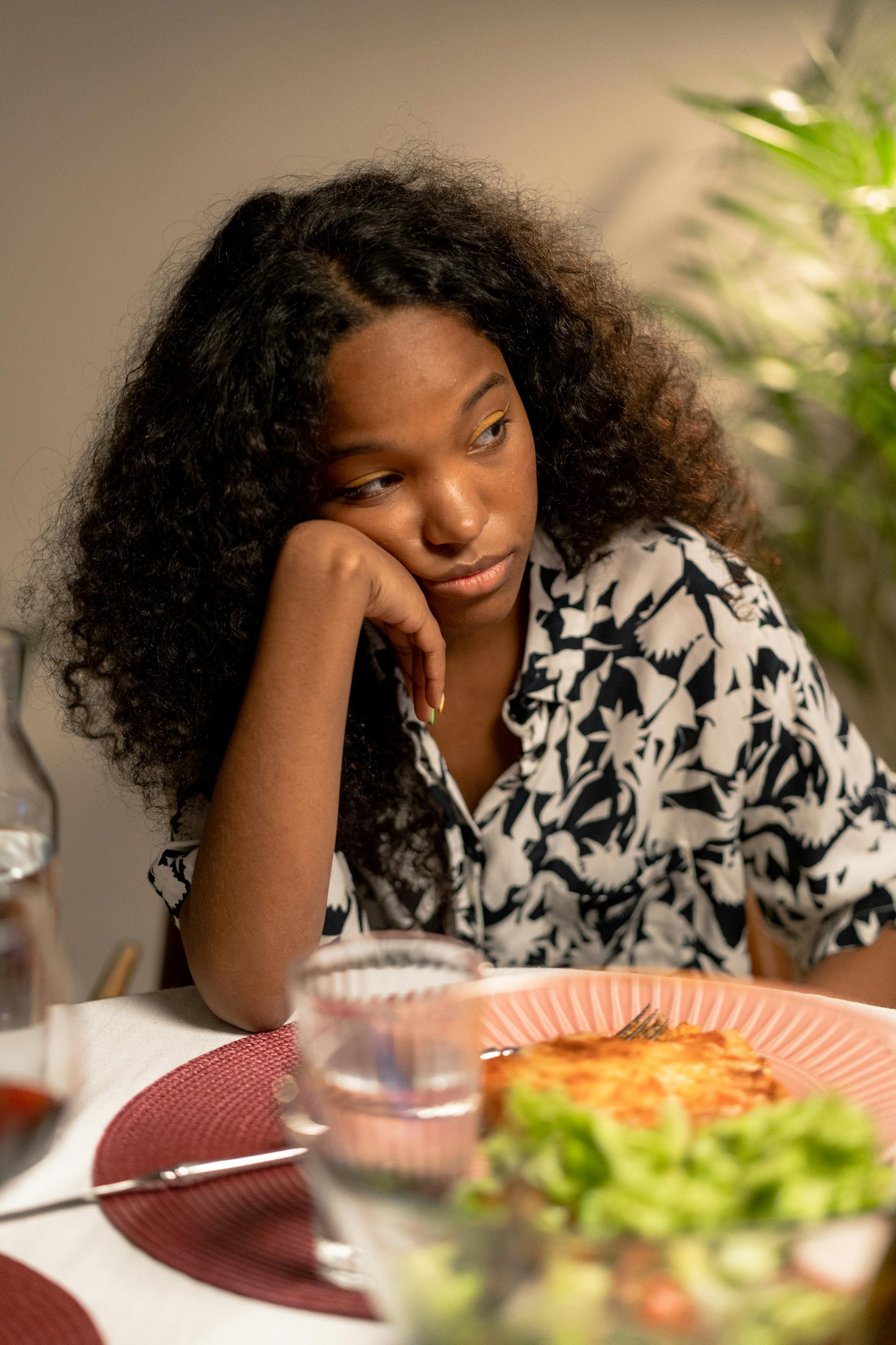 A sad woman at dinner | Source: Pexels