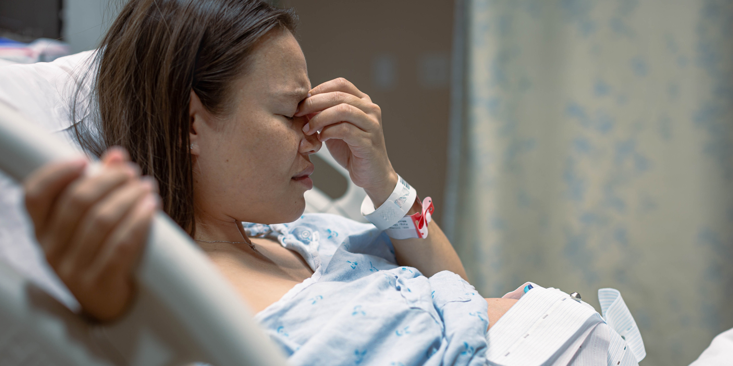 A pregnant woman in a hospital bed | Source: Shutterstock