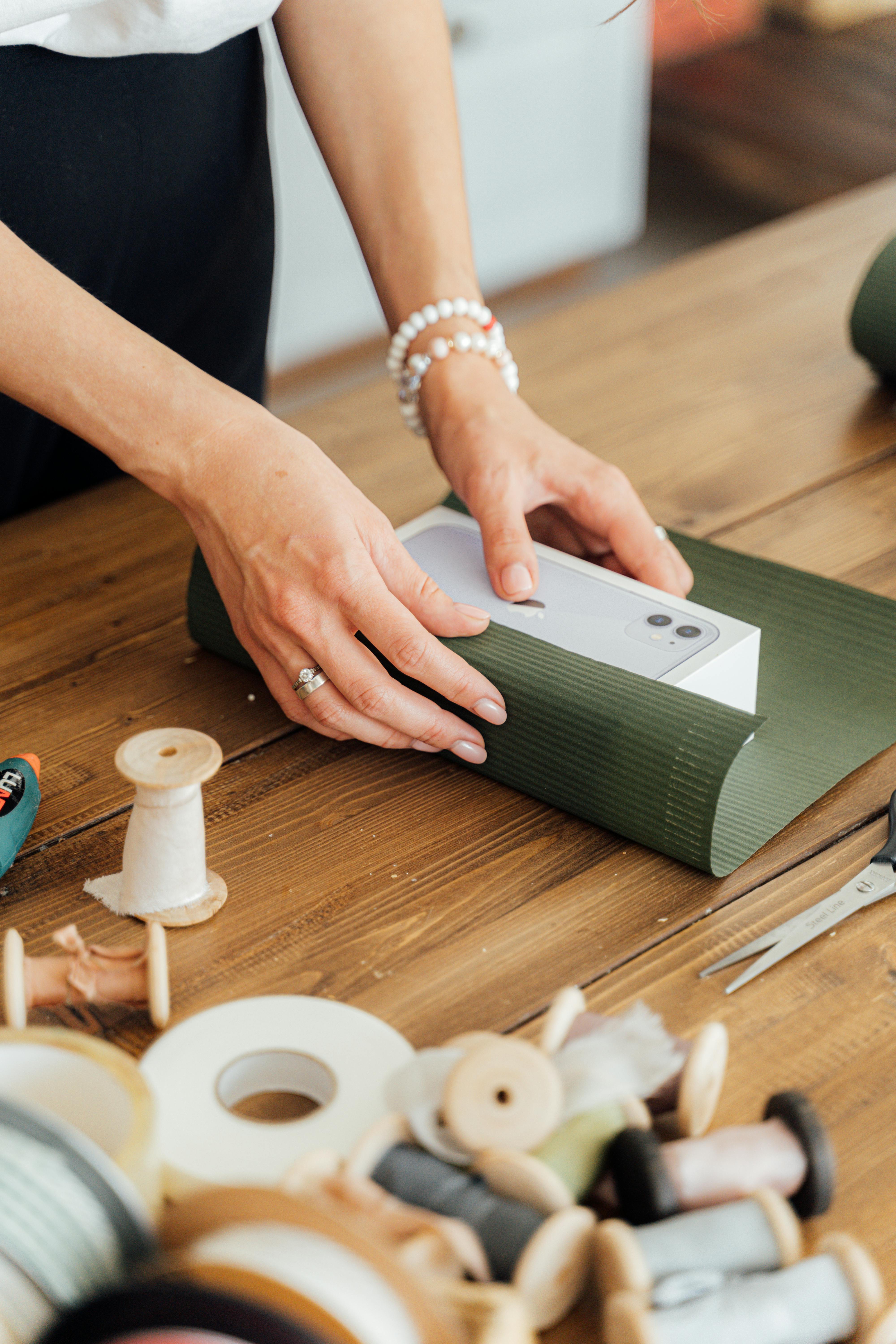 A person wrapping a gift | Source: Pexels